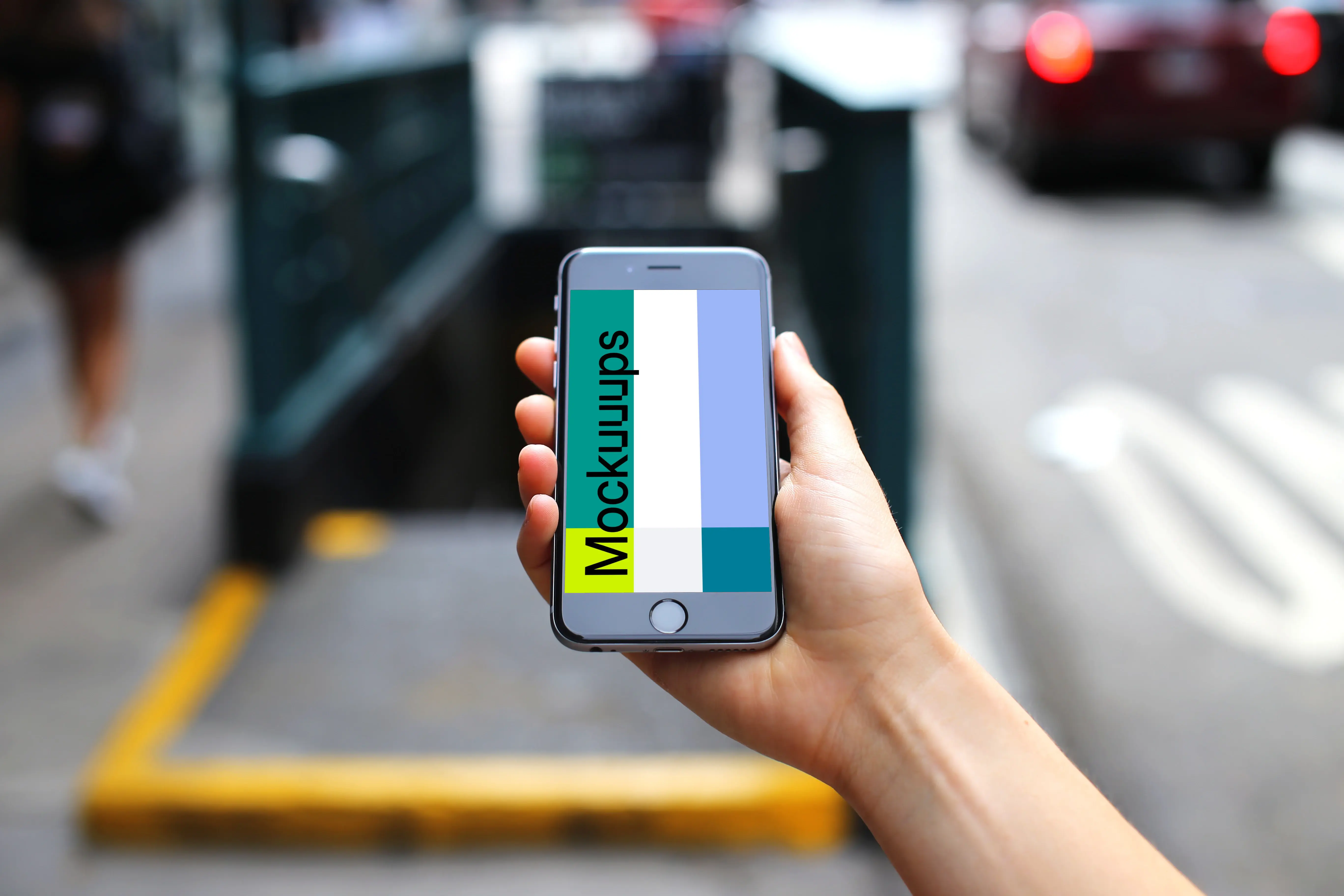 iPhone 6s mockup in front of Underground Entrance