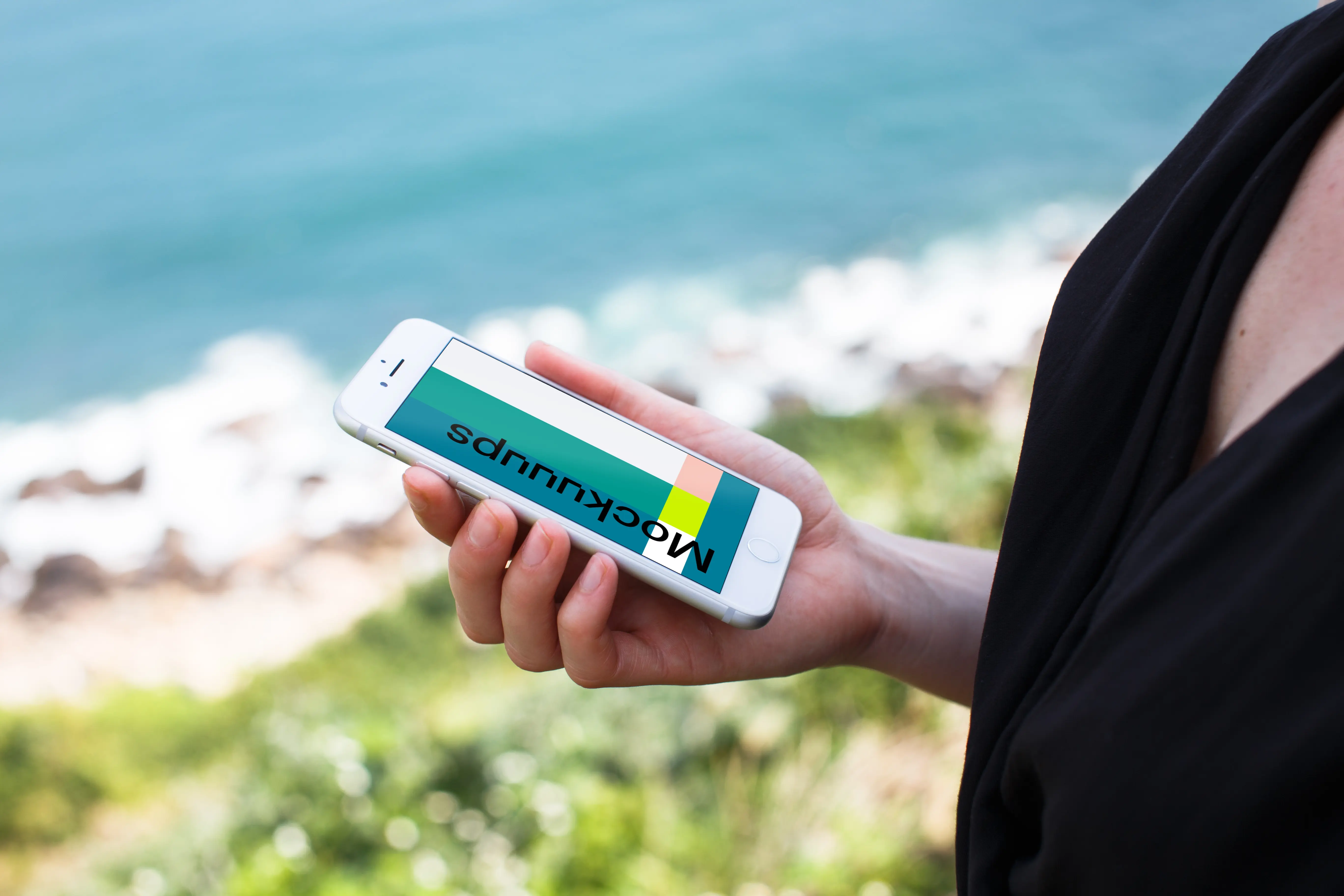 iPhone 7 Silver mockup with ocean in the background