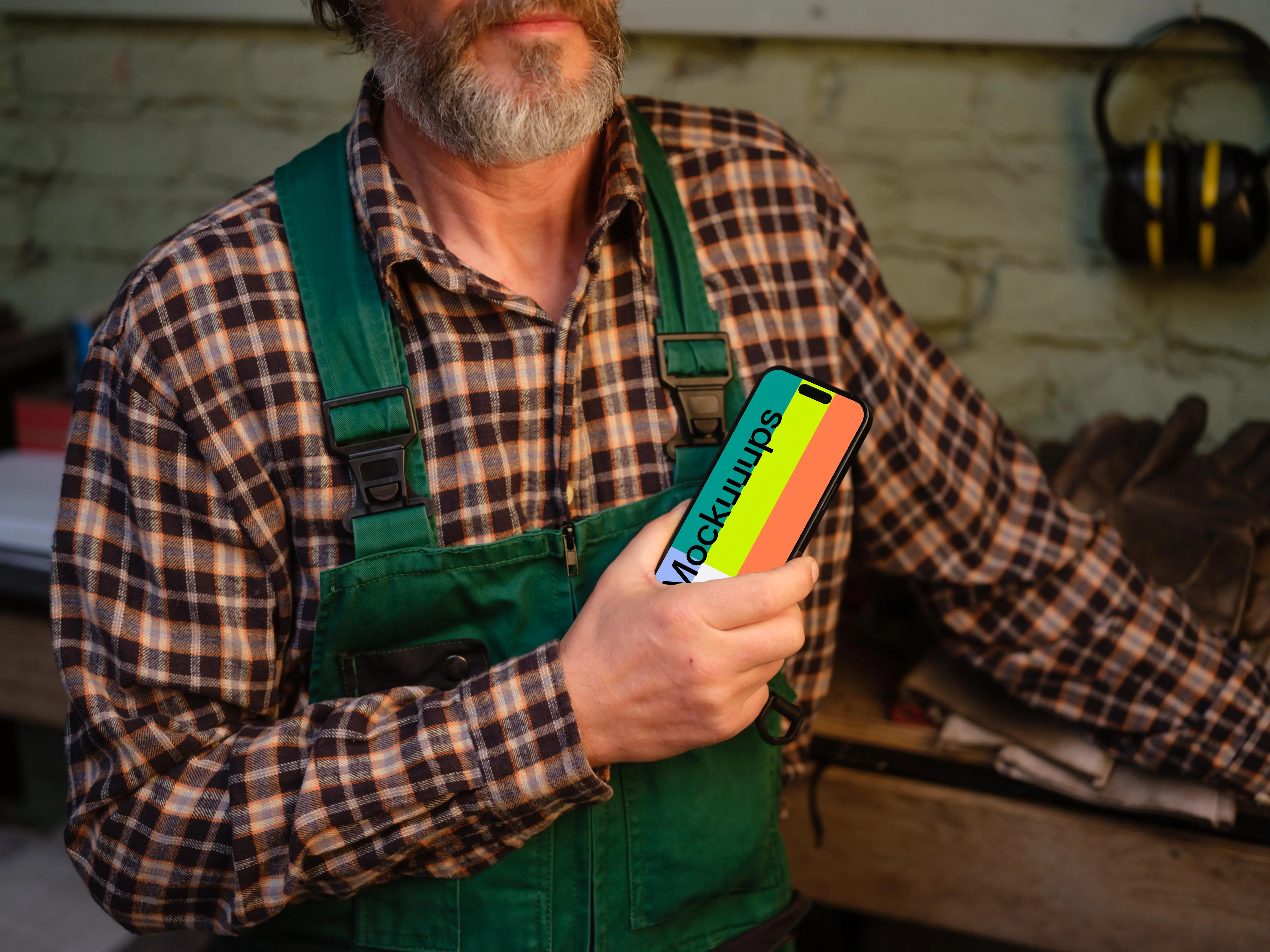 iPhone mockup held by the mechanic