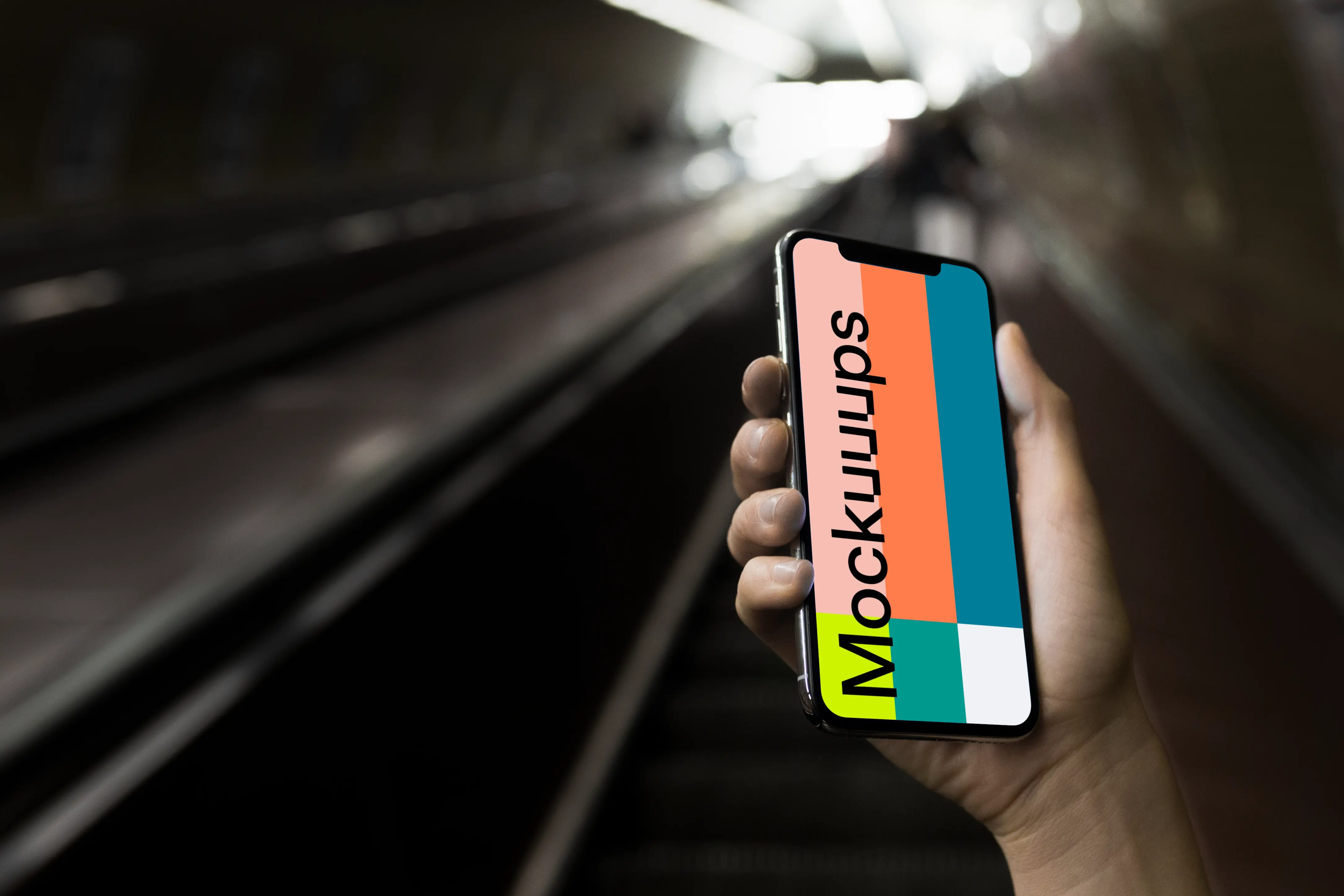 iPhone X mockup in front of underground Entrance