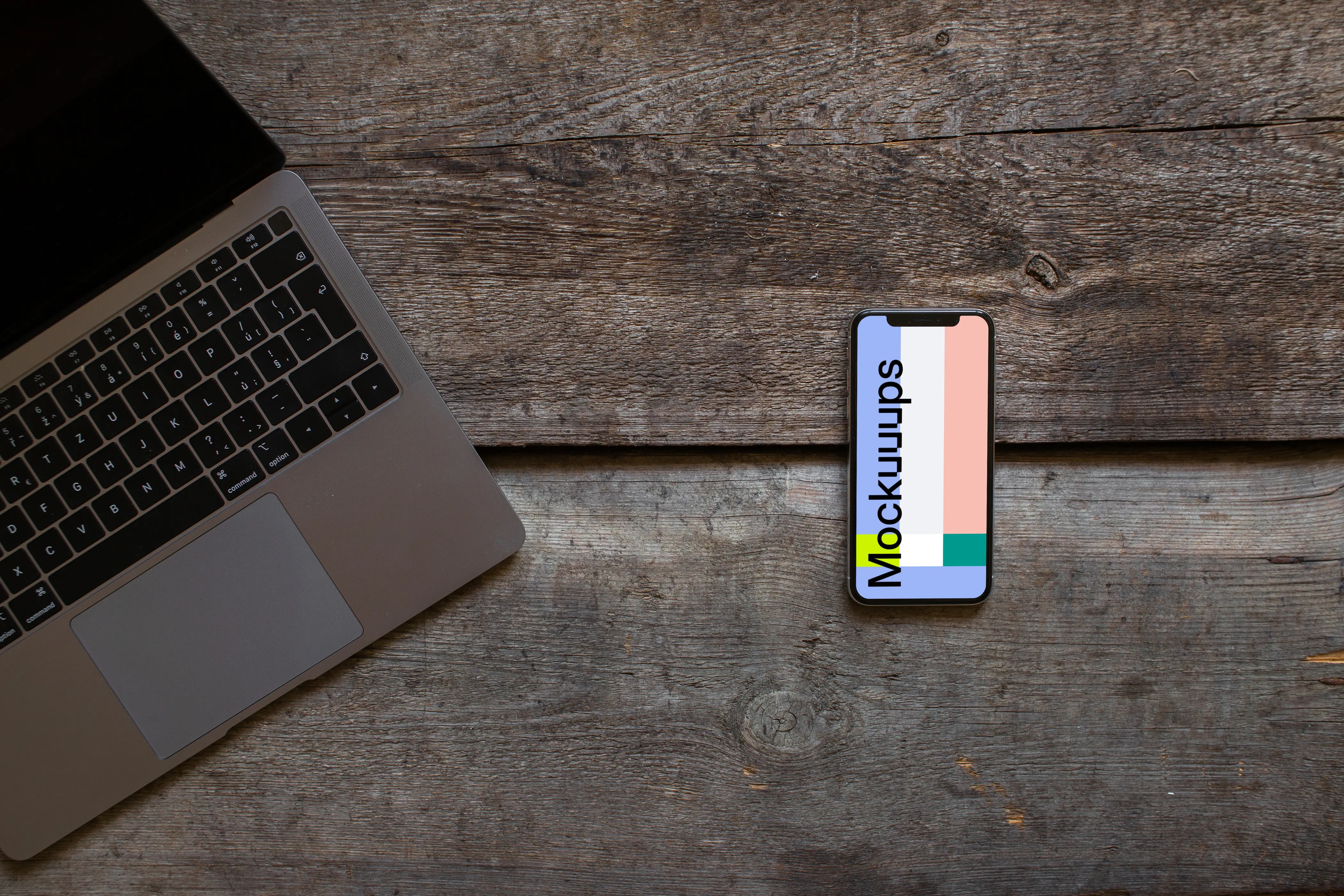 iPhone XS mockup and cropped Macbook Air on the wooden table