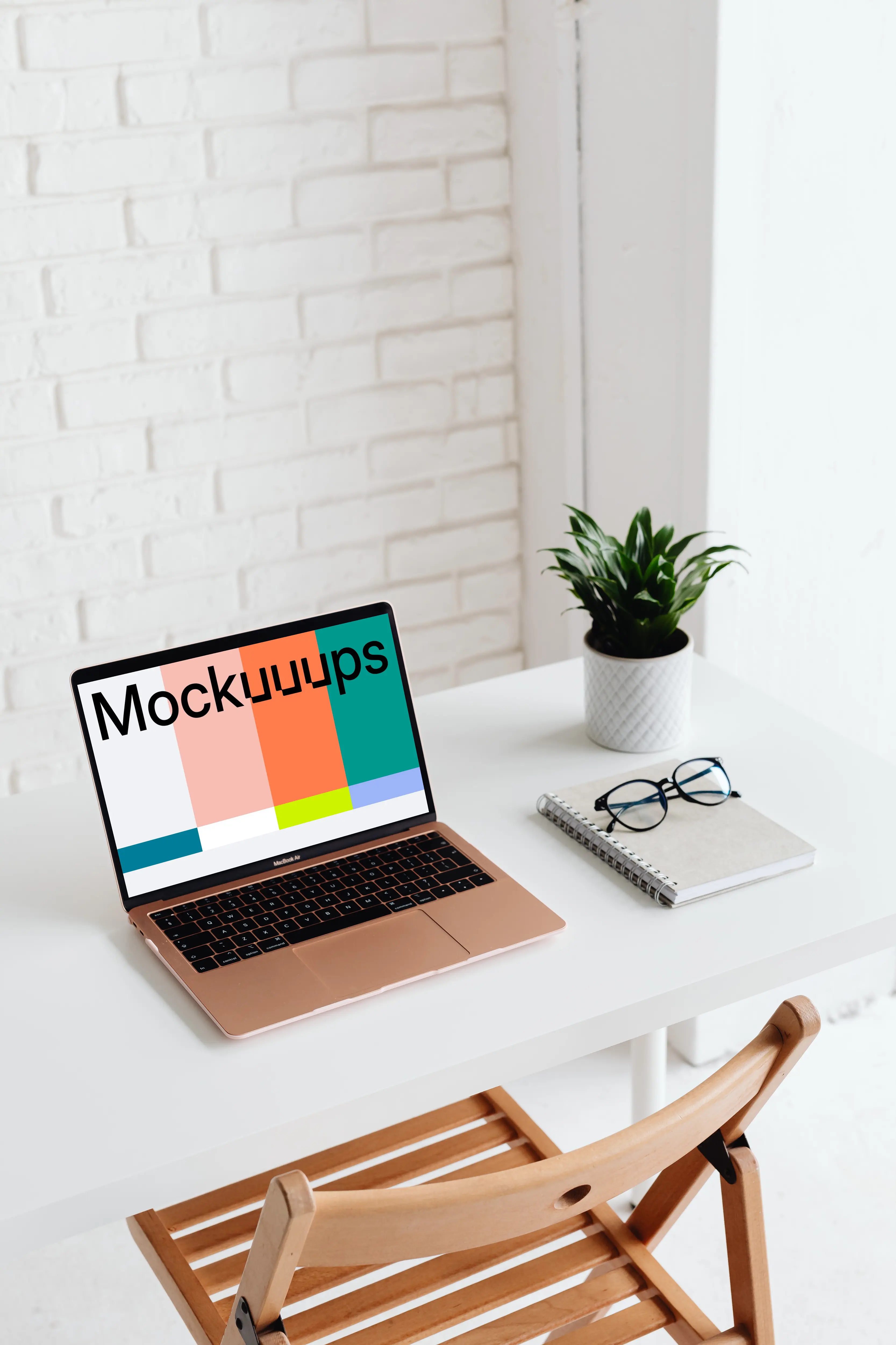 MacBook Air mockup beside a white notebook