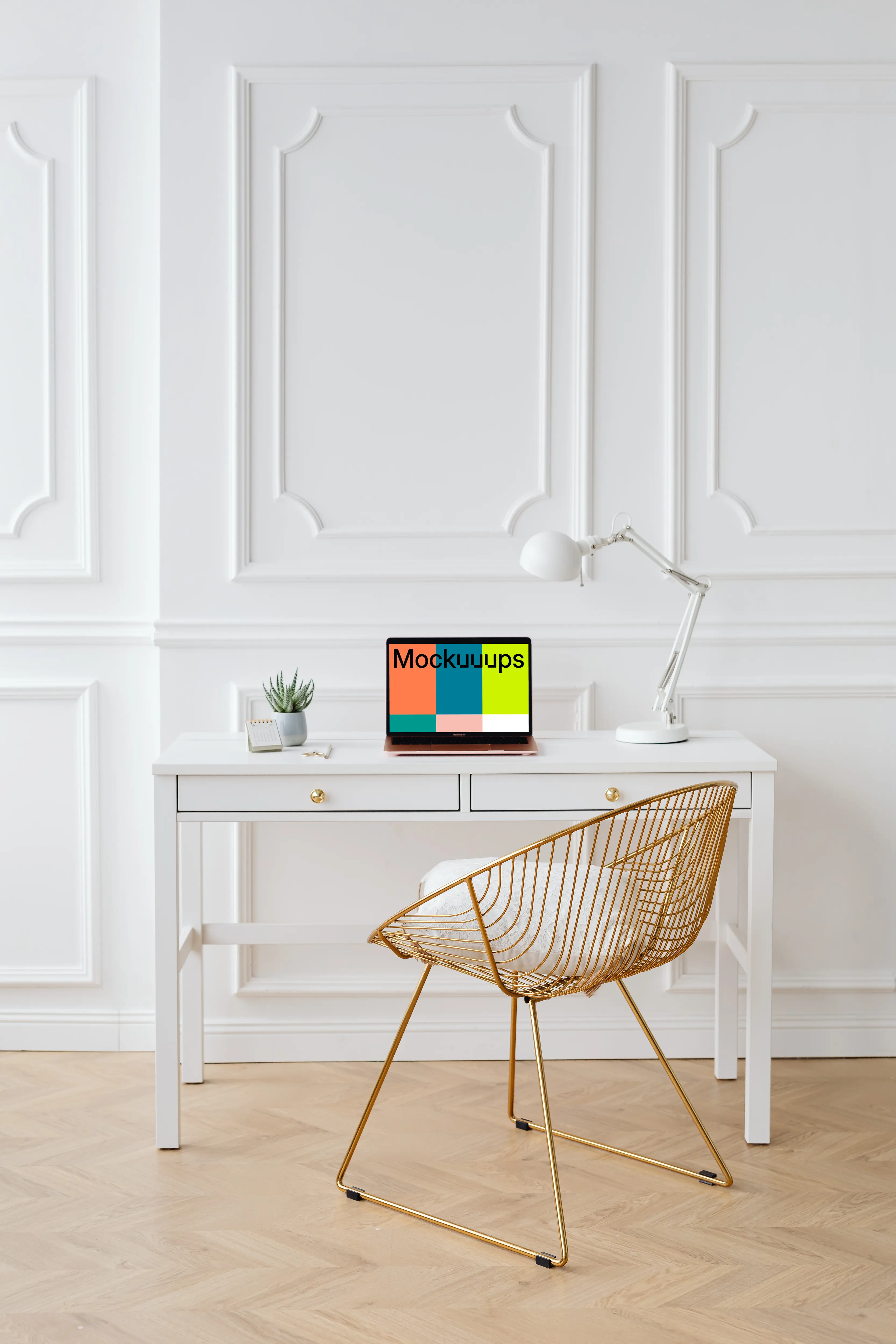 MacBook Air mockup on a table beside a reading lamp