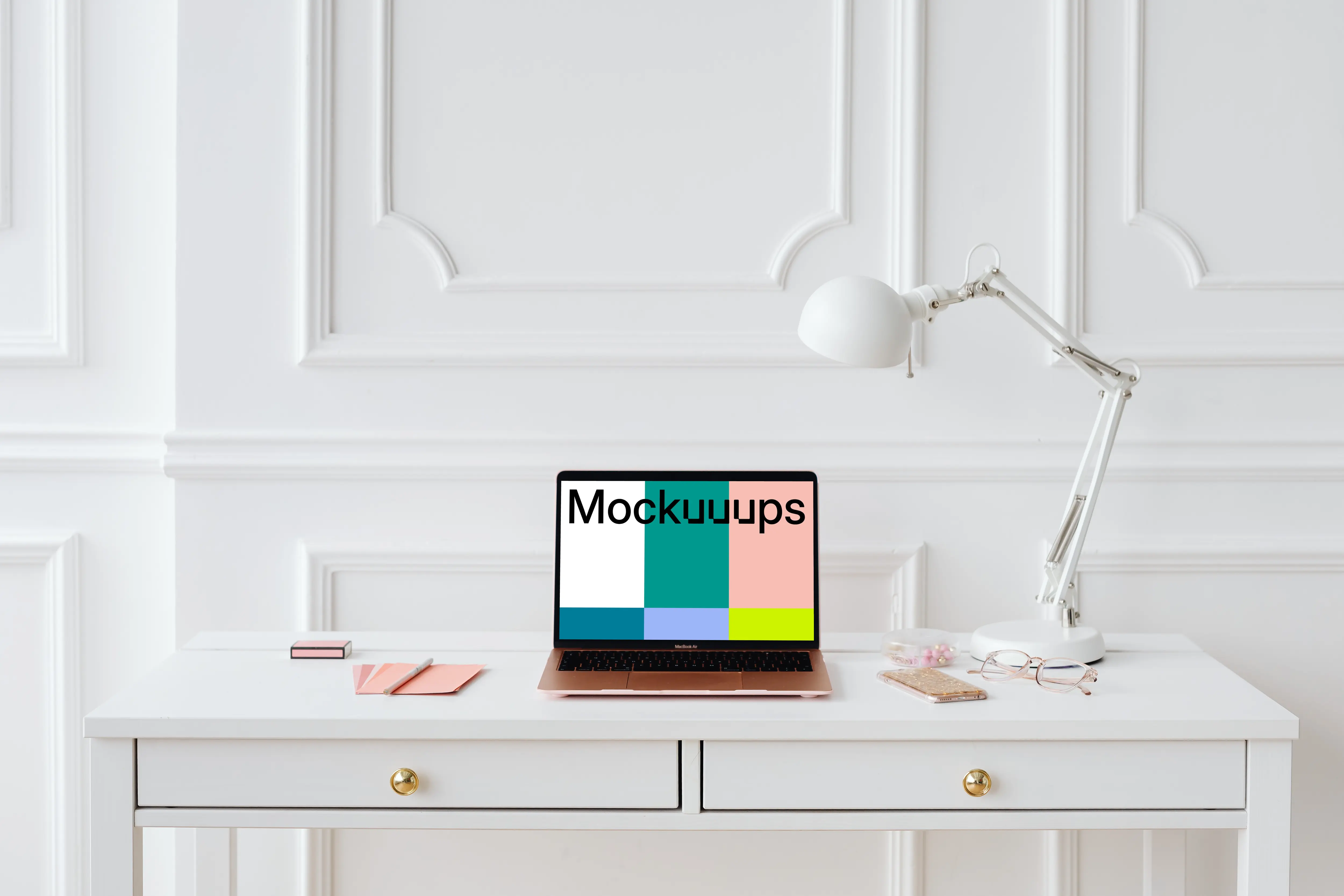 MacBook Air mockup on a table beside an iPhone