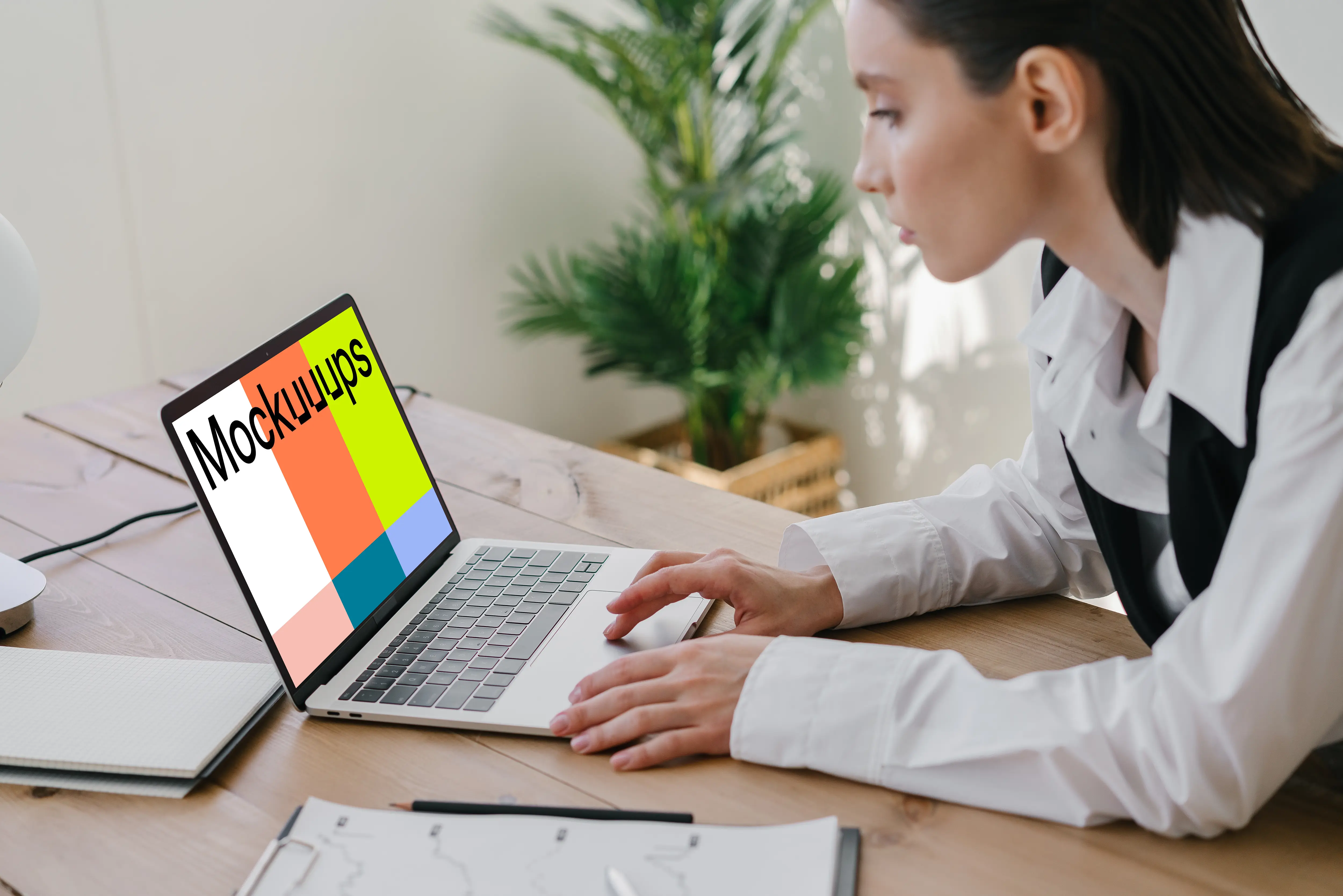 MacBook Air Mockup used by a corporately dressed lady 