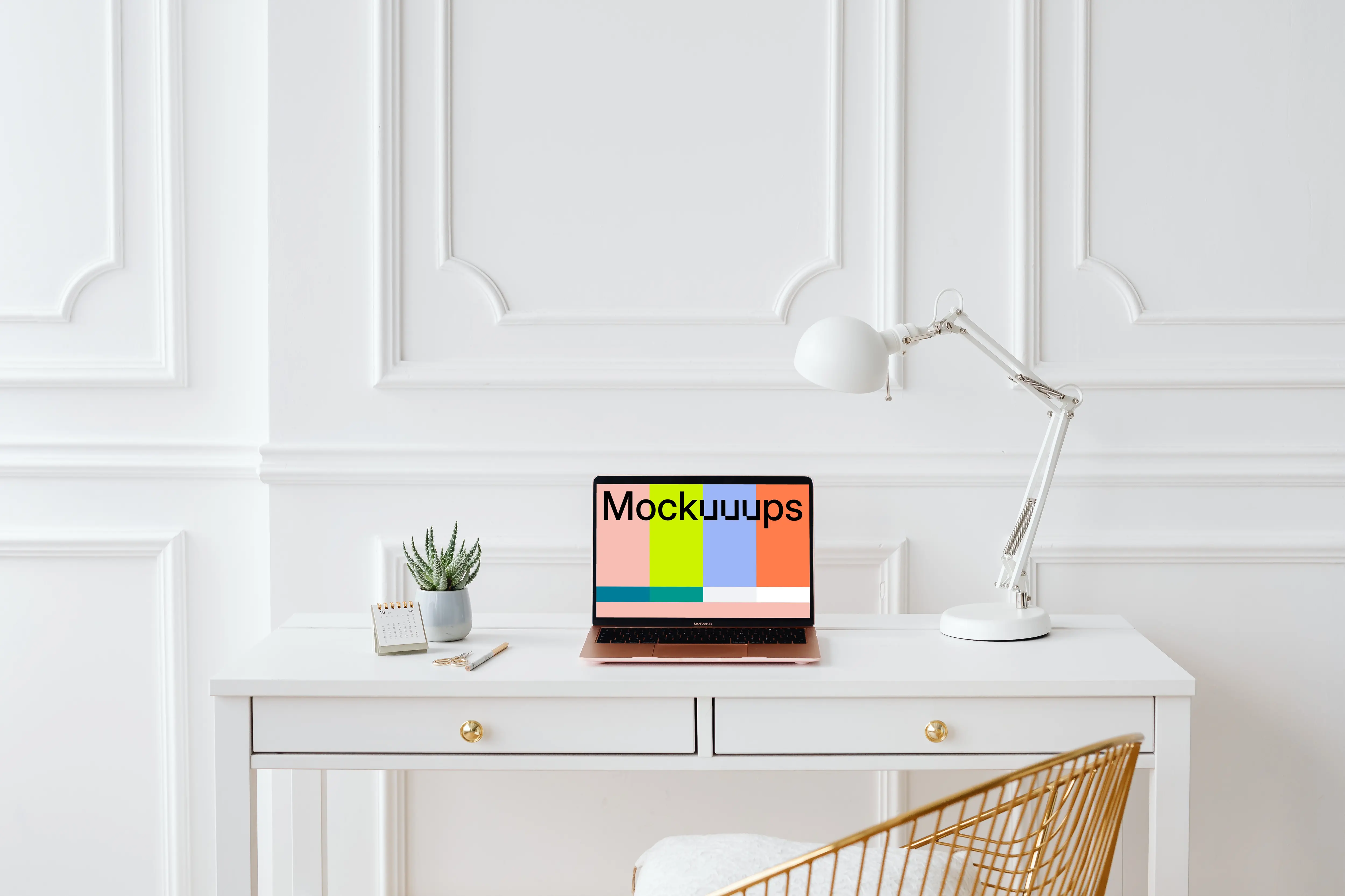 MacBook Air mockup with a white reading lamp at its side.