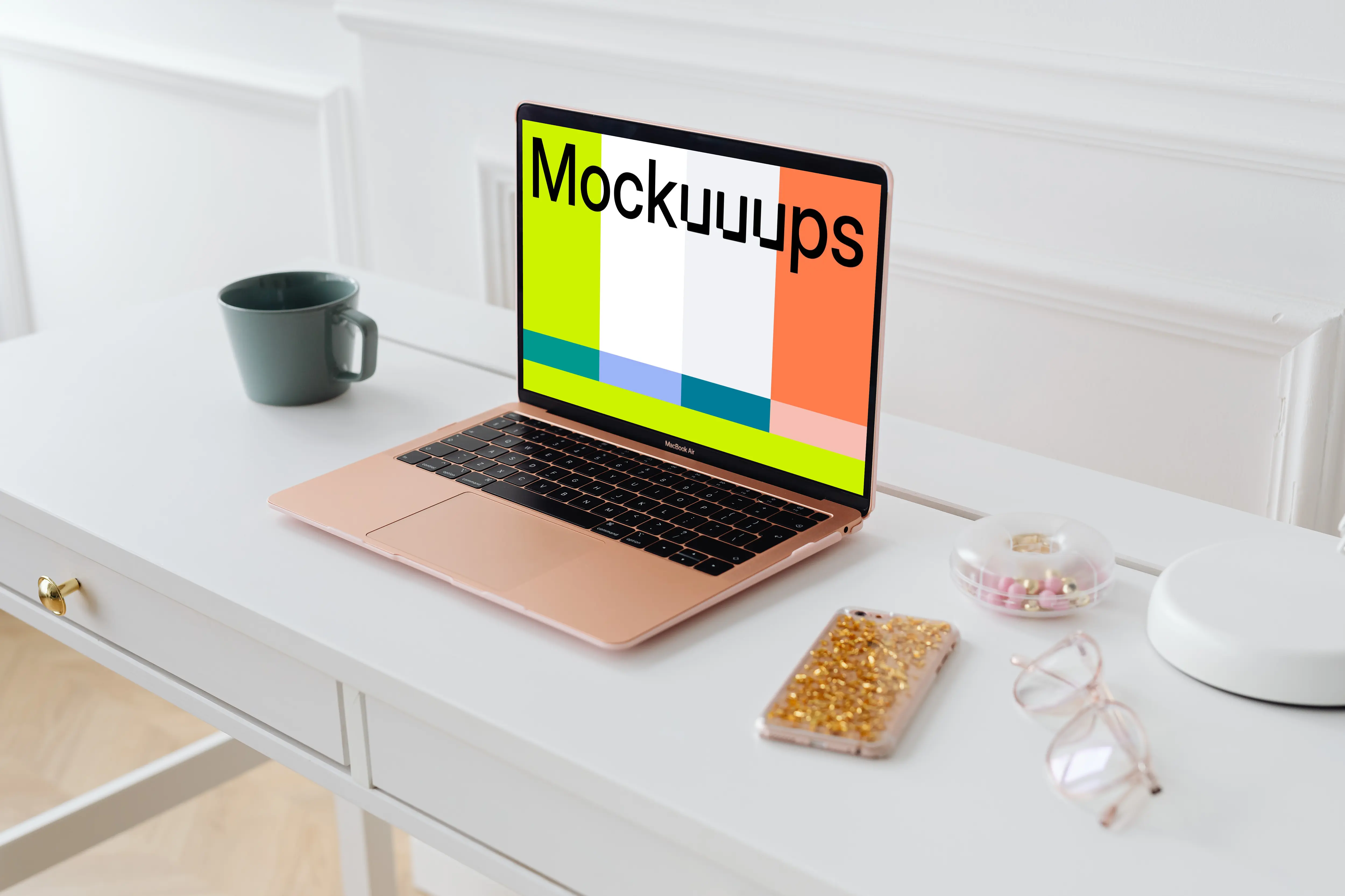 MacBook Air mockup with an iPhone at the side