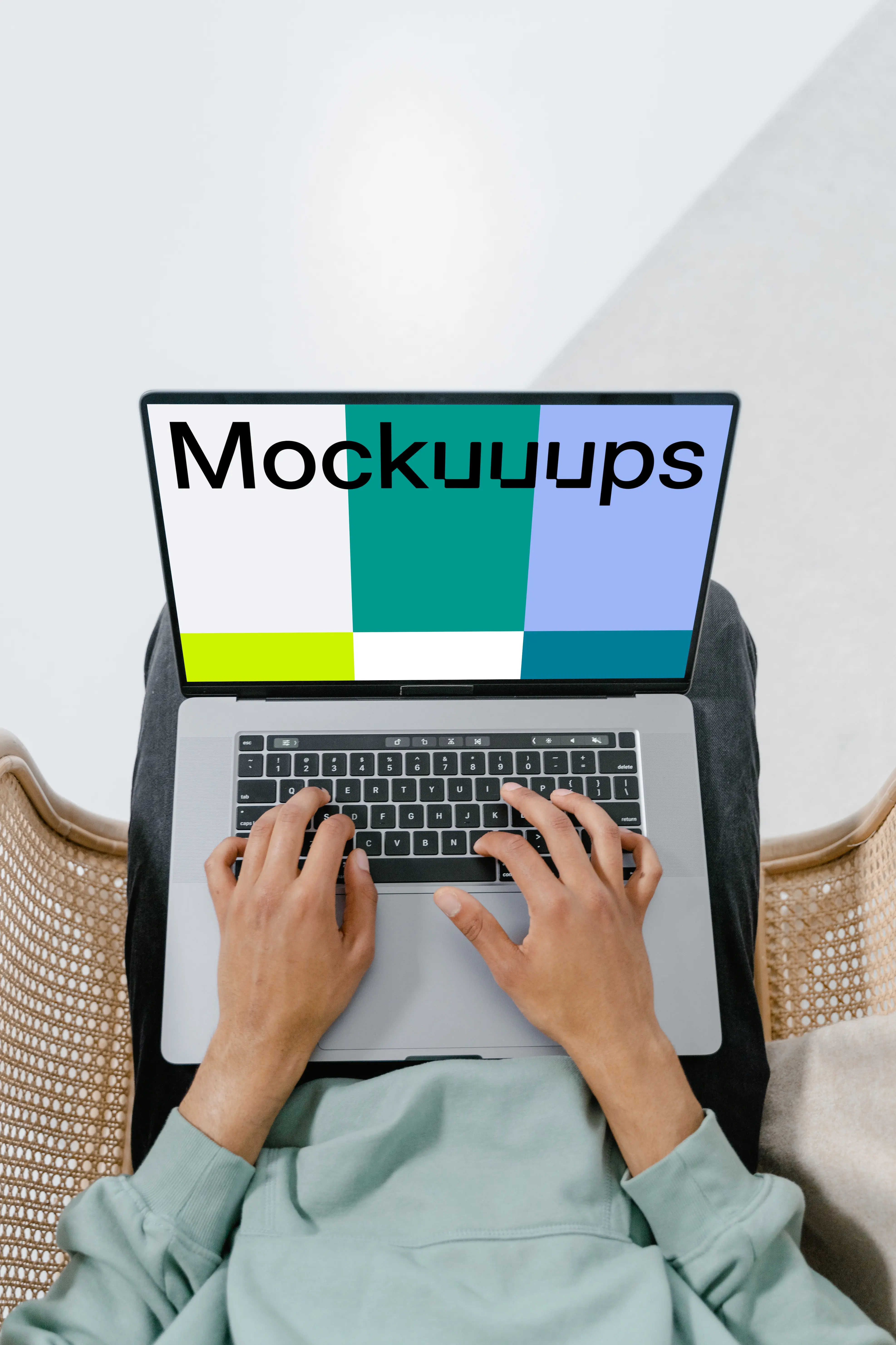 MacBook mockup held in user’s laps