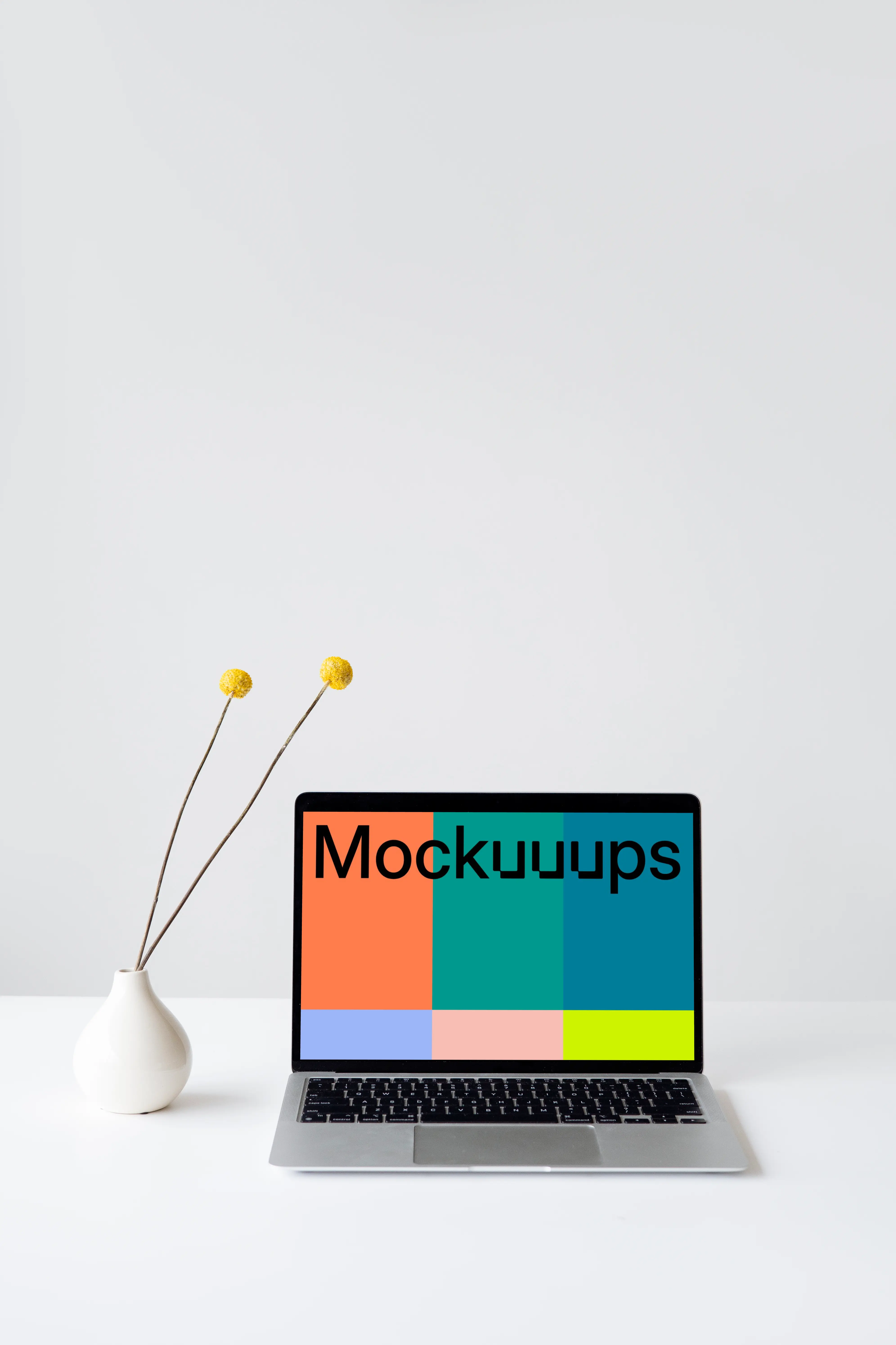 MacBook mockup on a white table