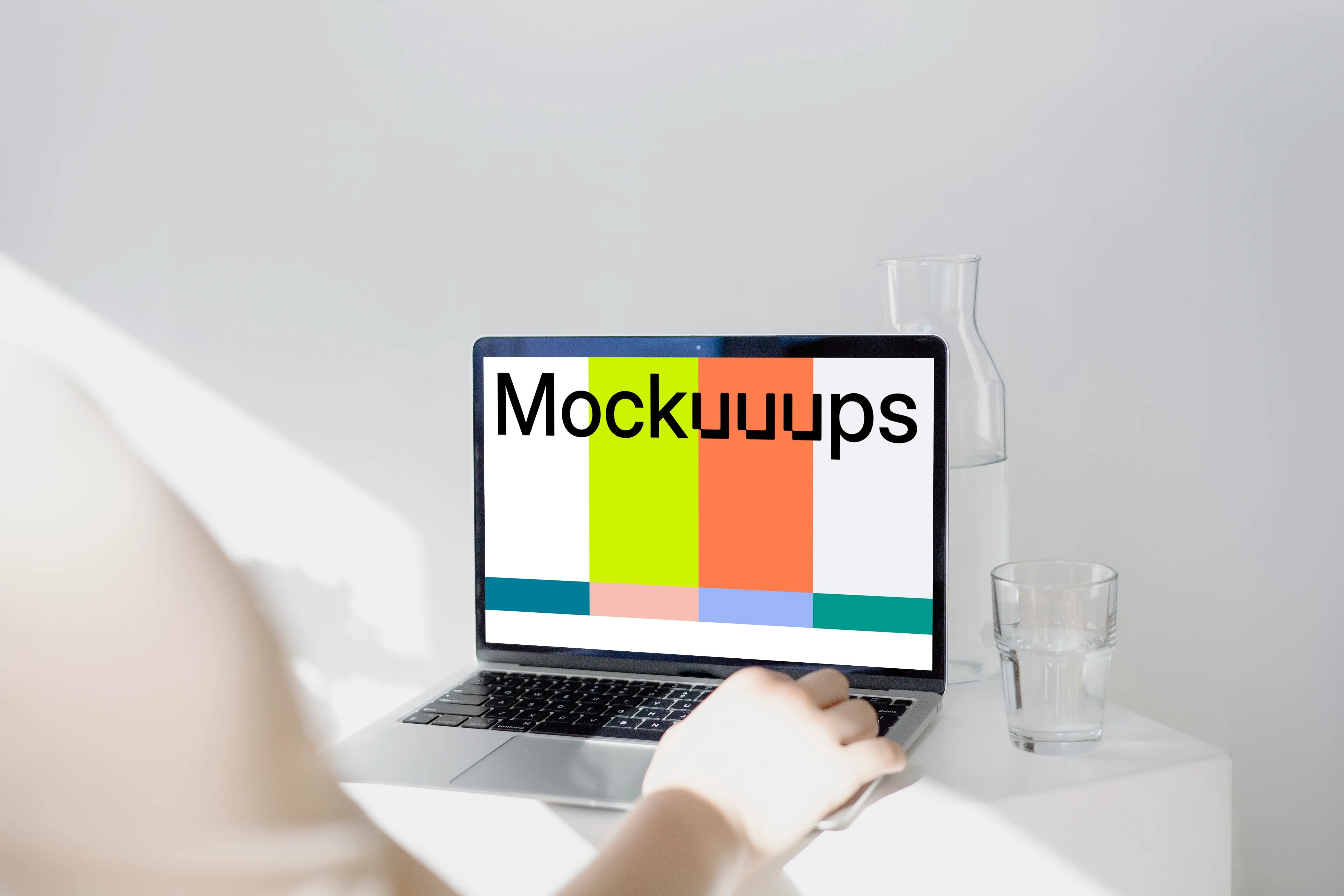 MacBook Pro mockup before a glass jar and tumbler