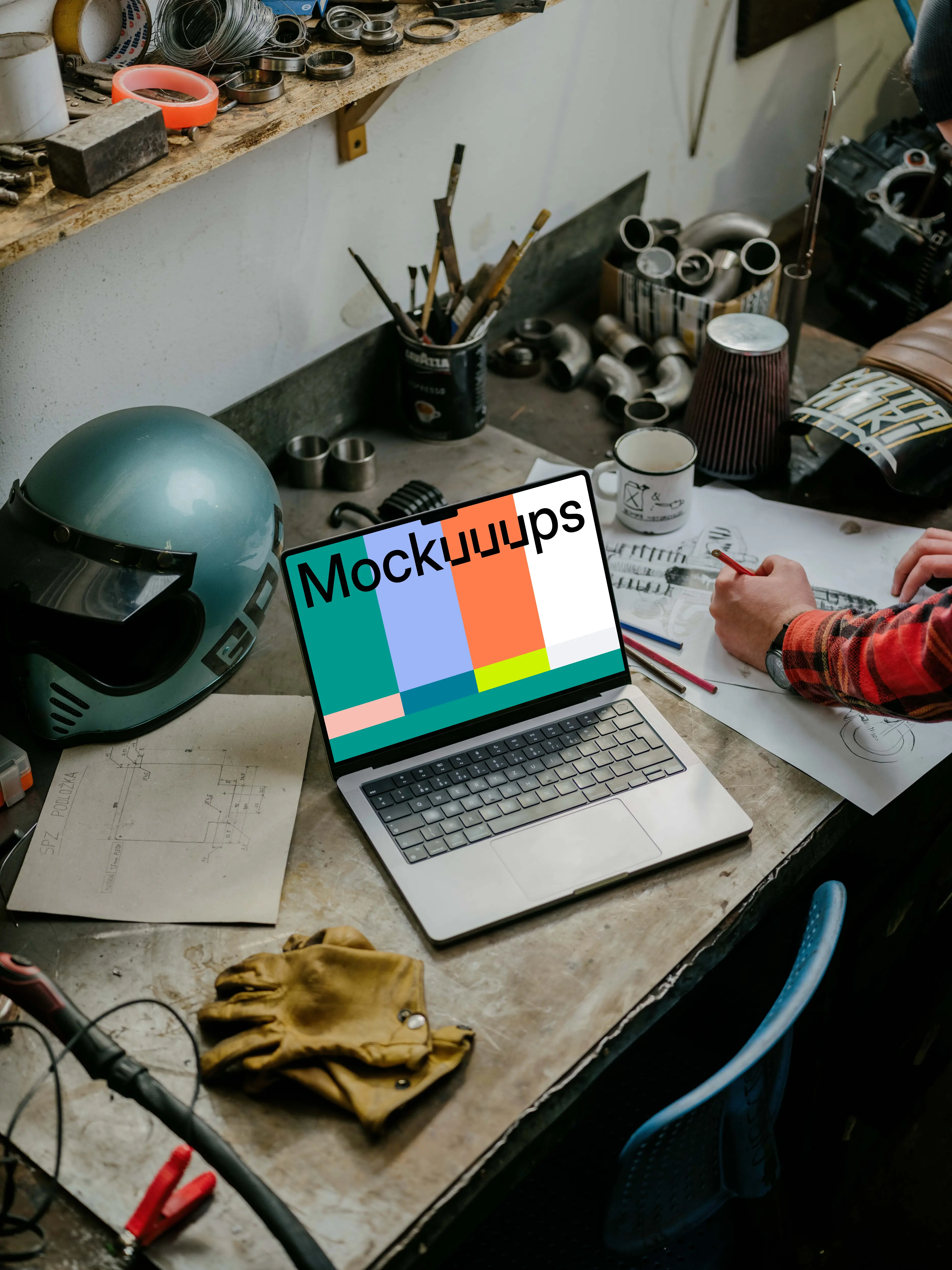 MacBook Pro mockup beside machine drawing