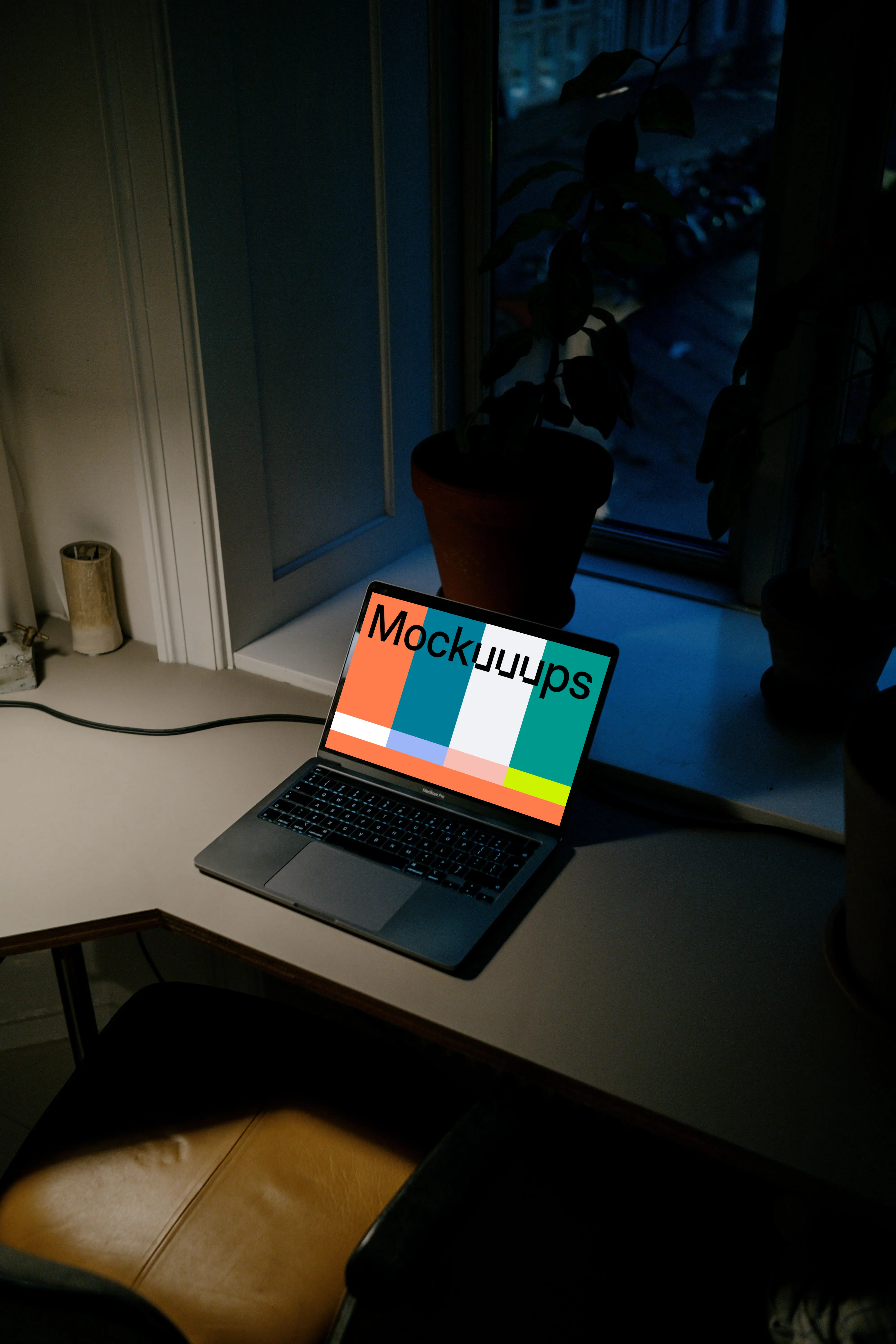 MacBook Pro mockup on a reading table