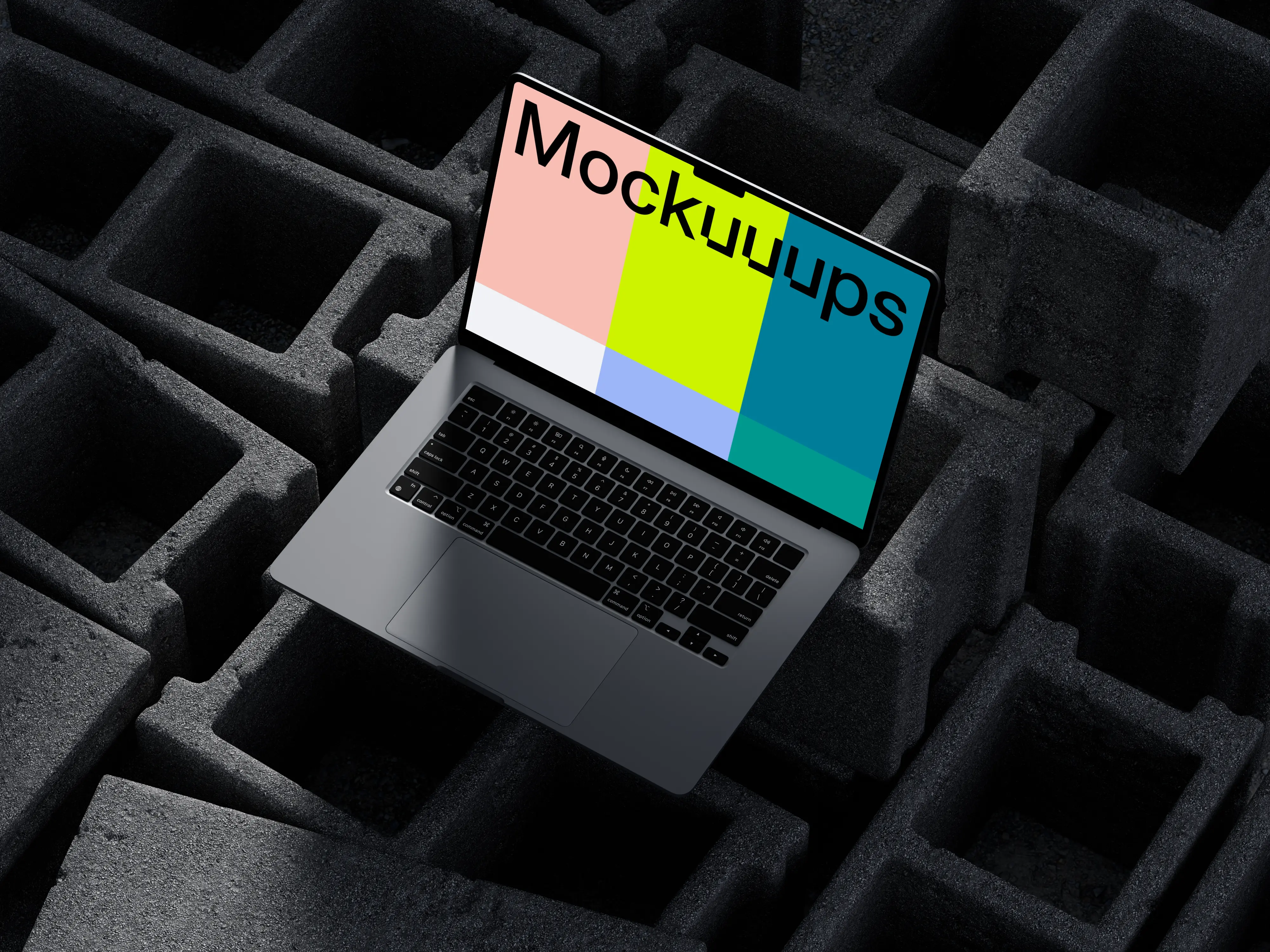 MacBook Pro mockup on textured concrete blocks
