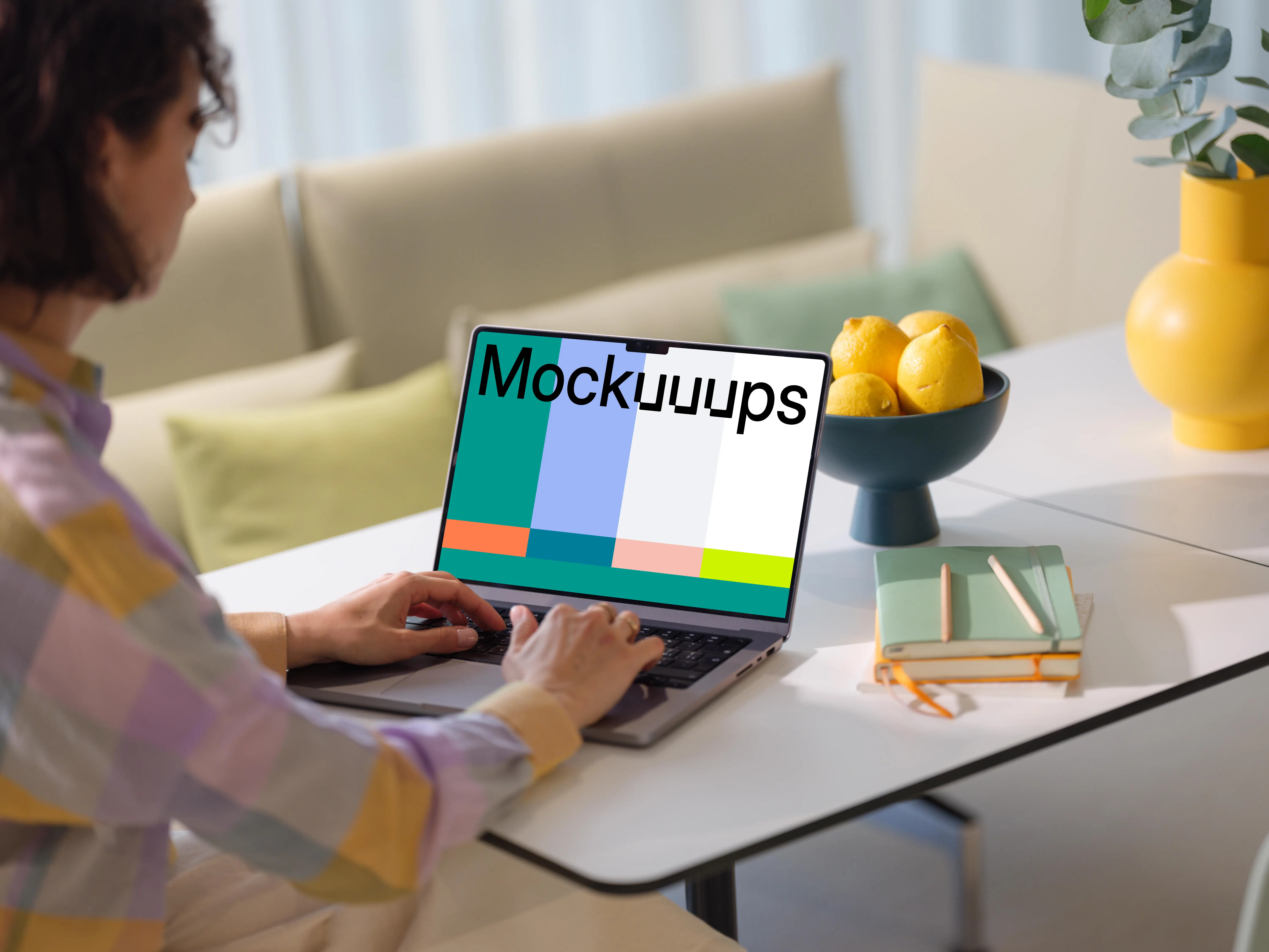 MacBook Pro mockup with woman at a modern home office