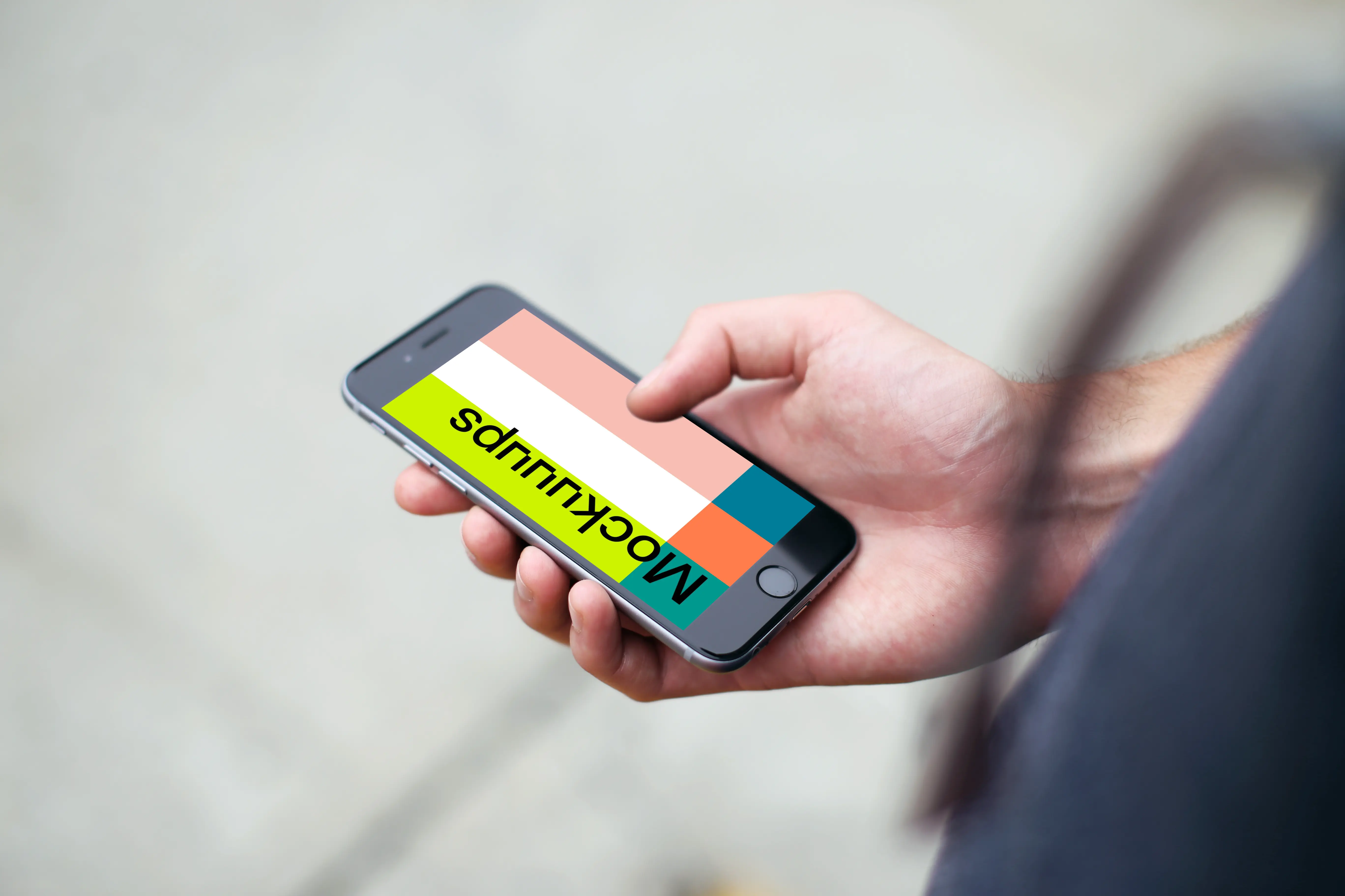 Man standing with iPhone 6s mockup on a street