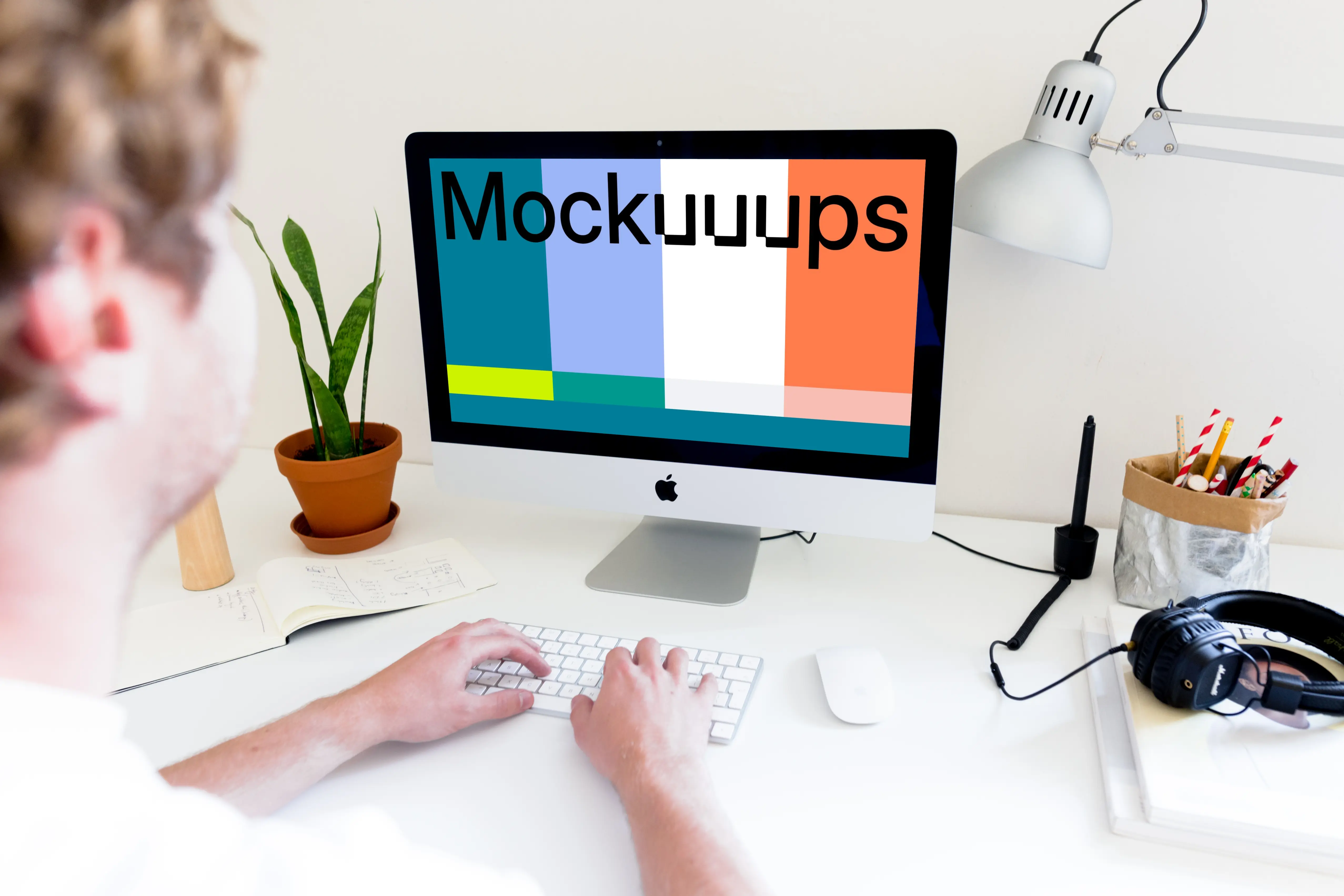 Man working on iMac mockup