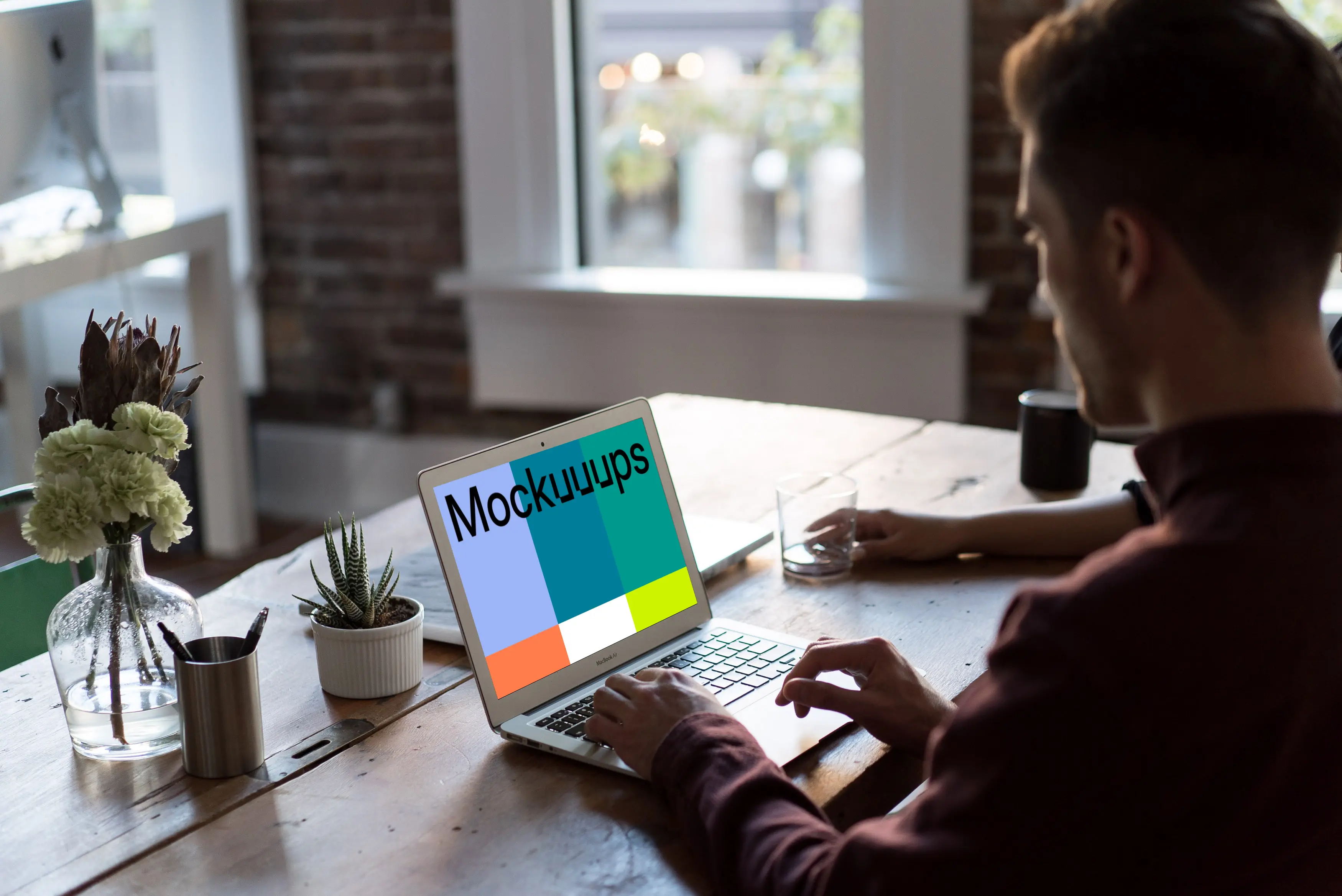 Man working on Macbook Air mockup