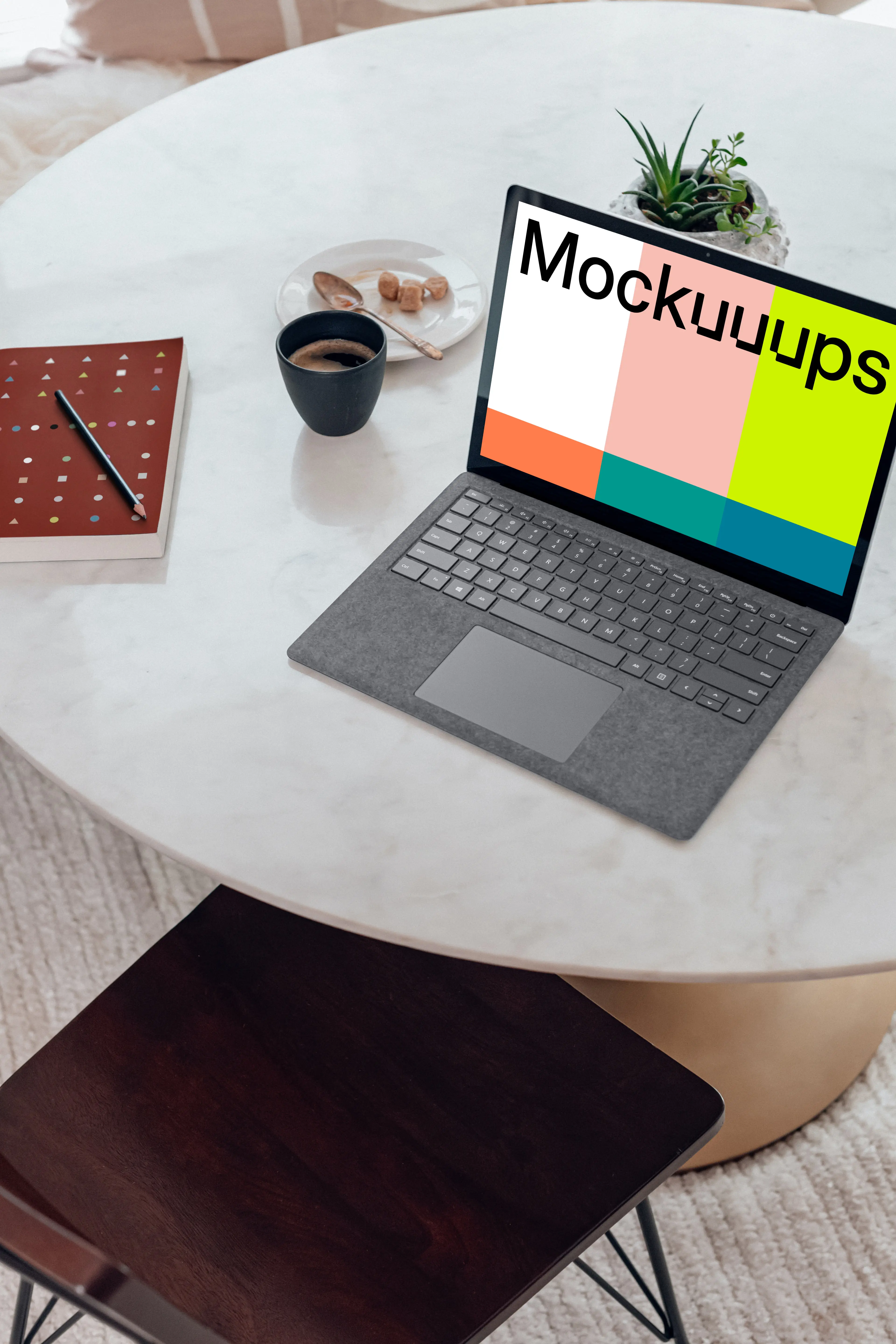 Microsoft Surface Laptop mockup on the marble table