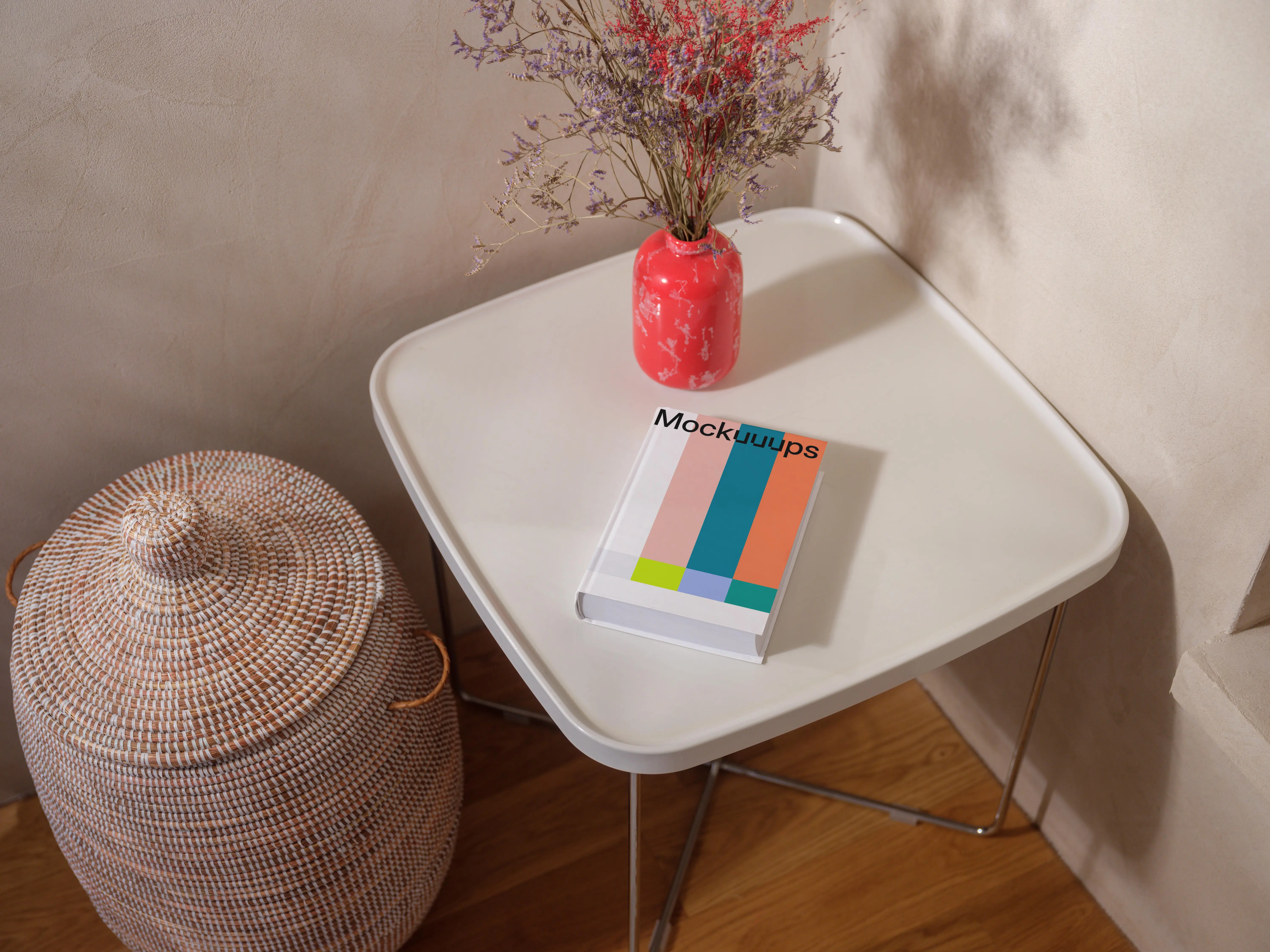 Mockup of a book on a minimalist table with decor