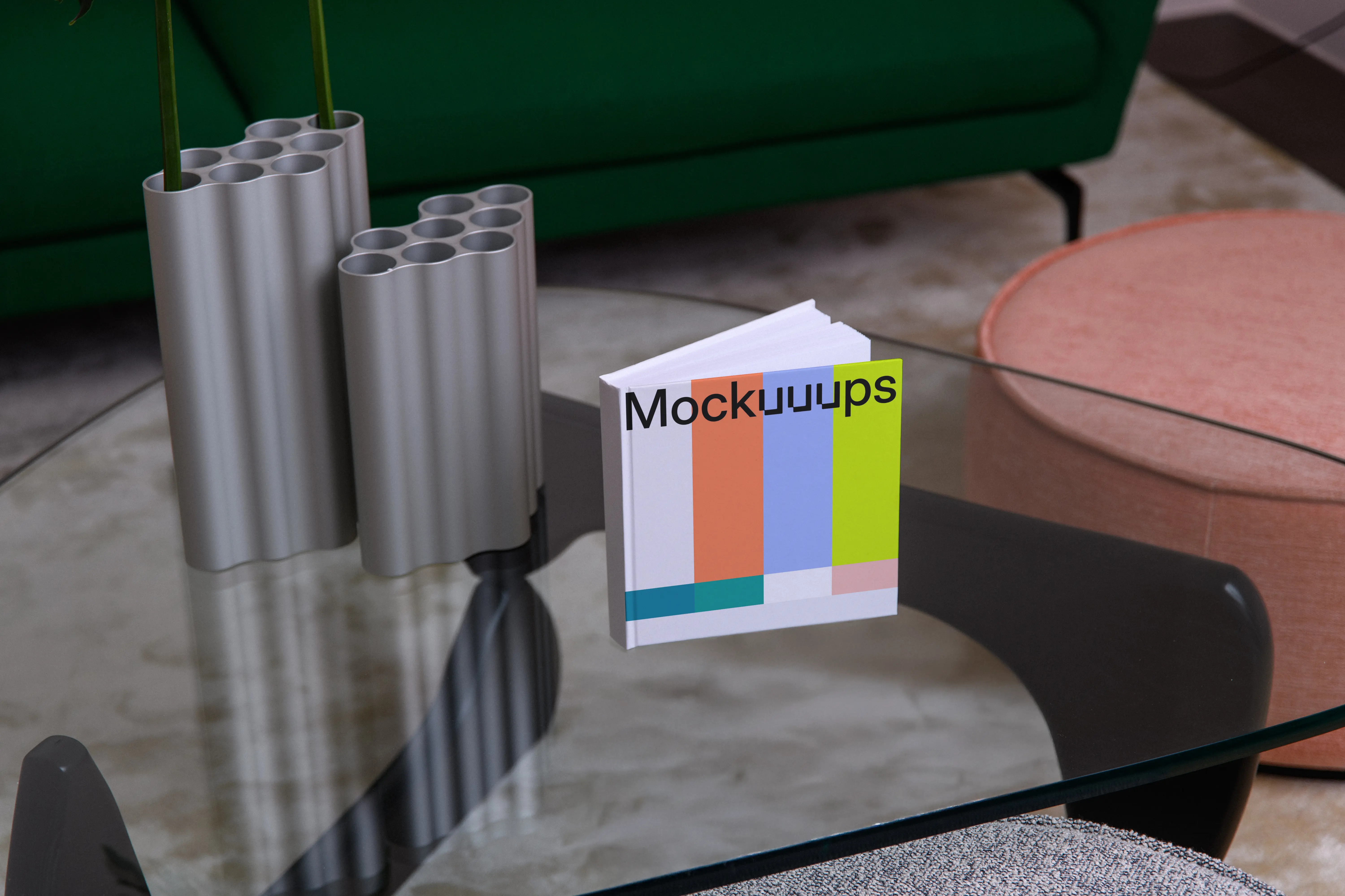 Mockup of a square book on a modern glass coffee table