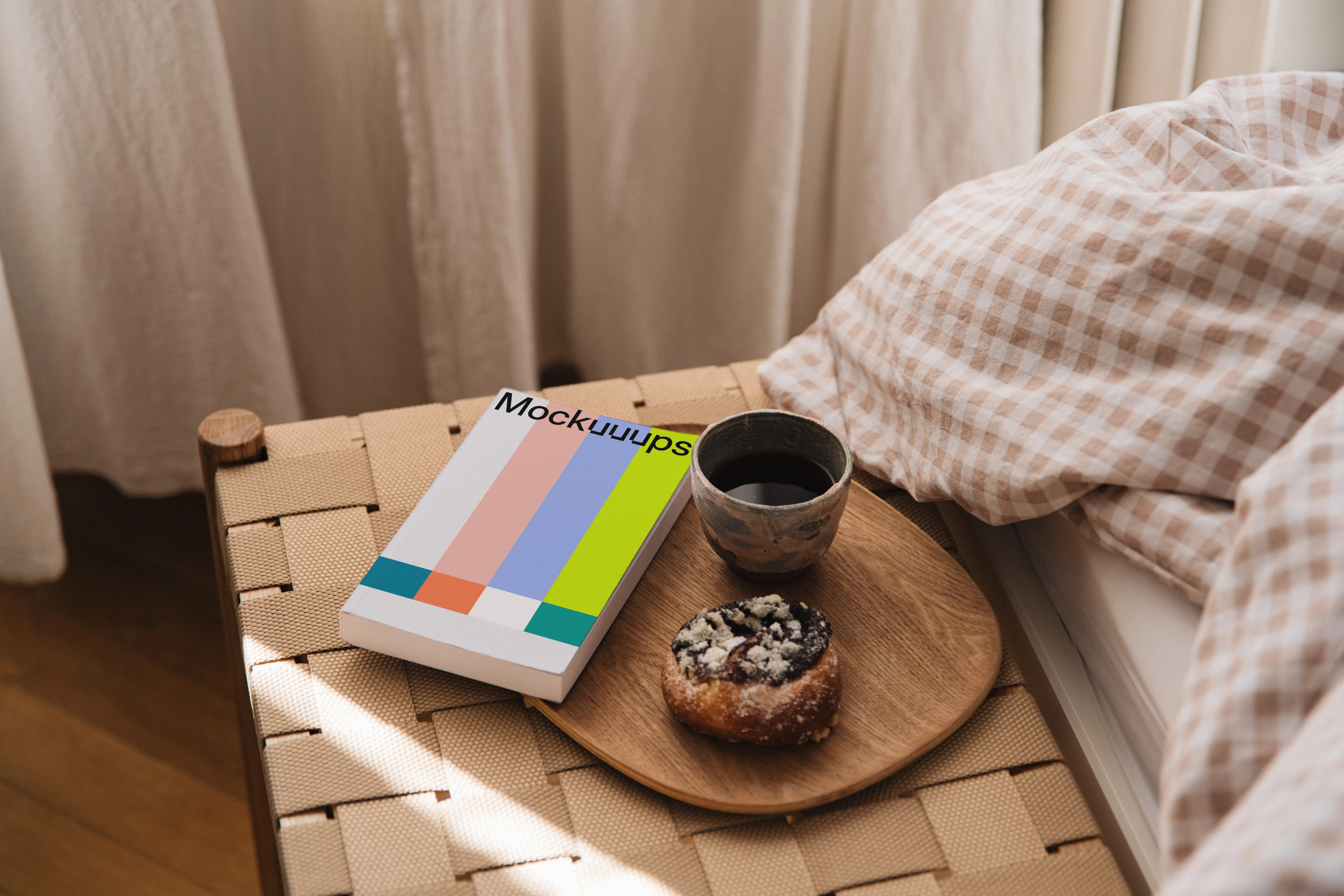 Paperback book mockup on a bedside table with breakfast