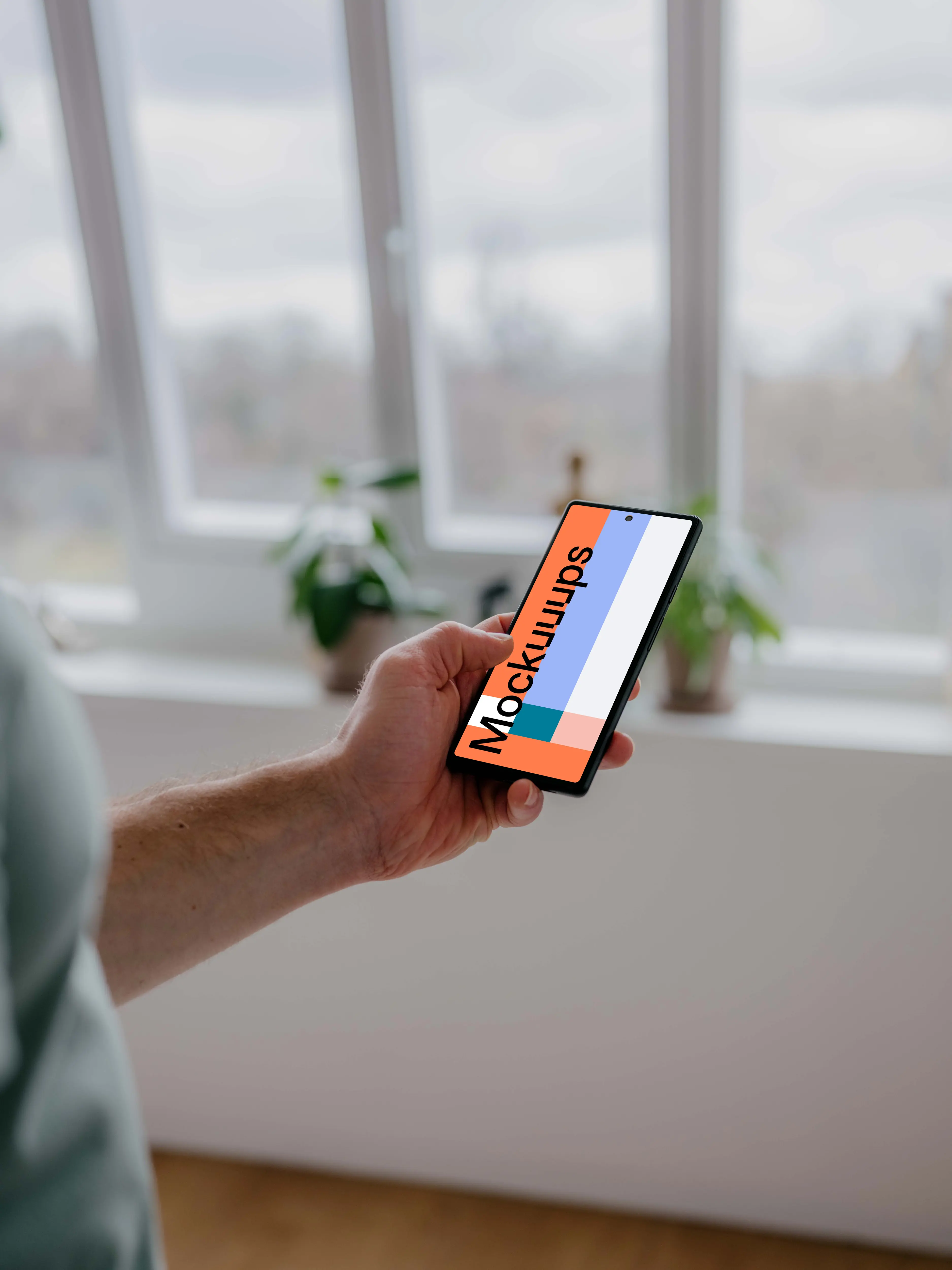 Person holding a Pixel 6 mockup