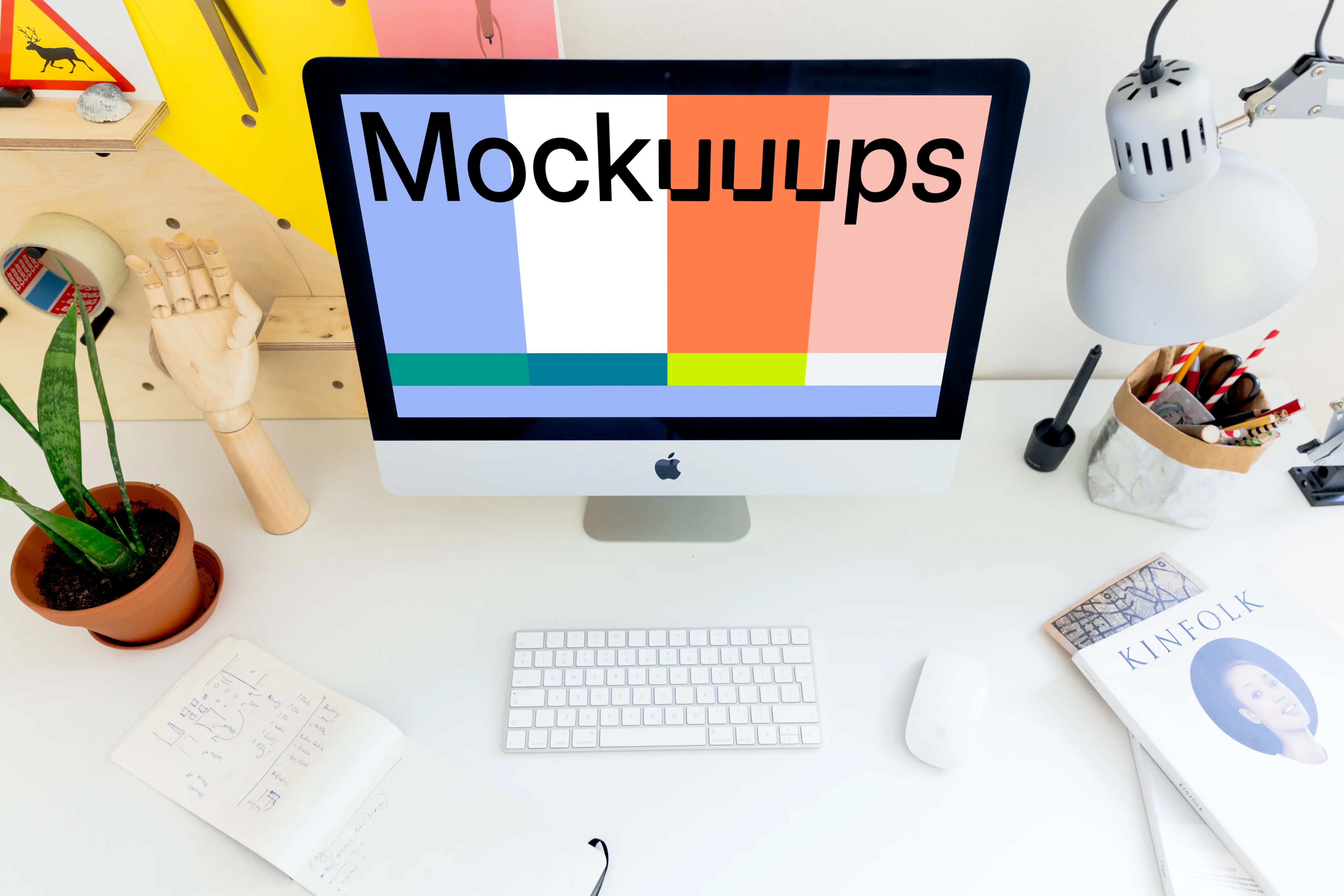 Perspective mockup of iMac on the white desk