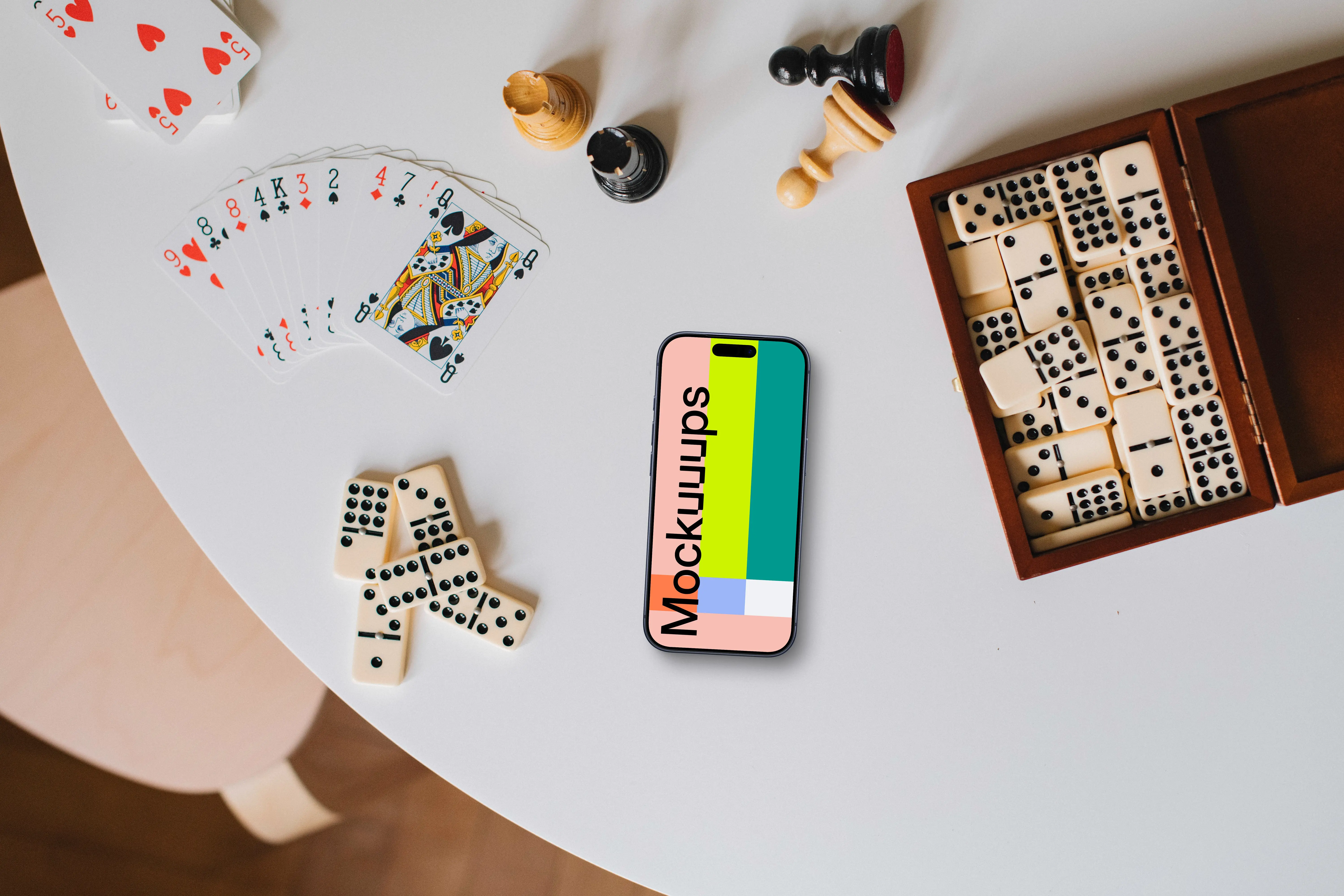 Playful environment including board games and iPhone mockup