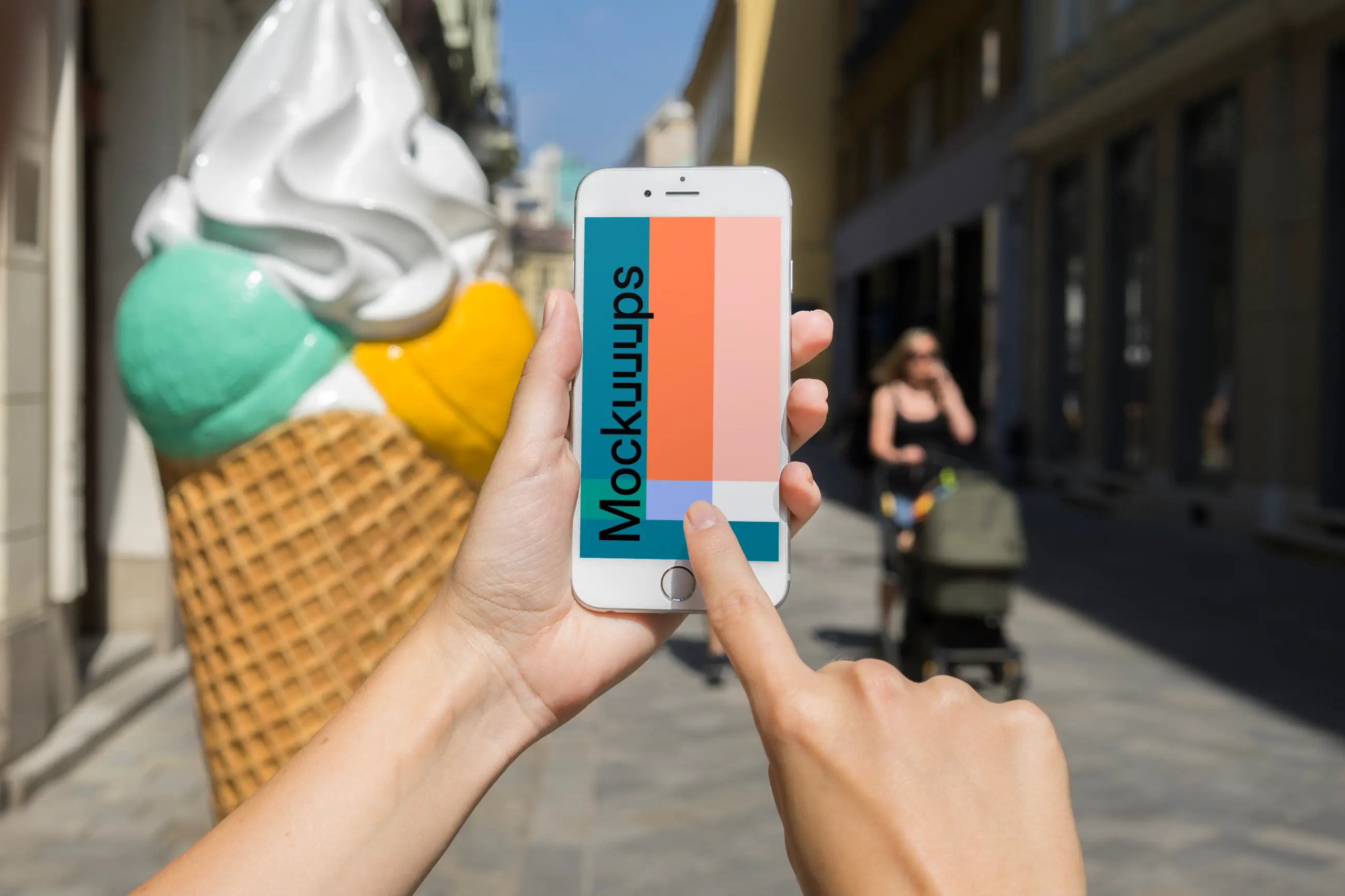 Pointing on iPhone 6 mockup in front of ice cream shop