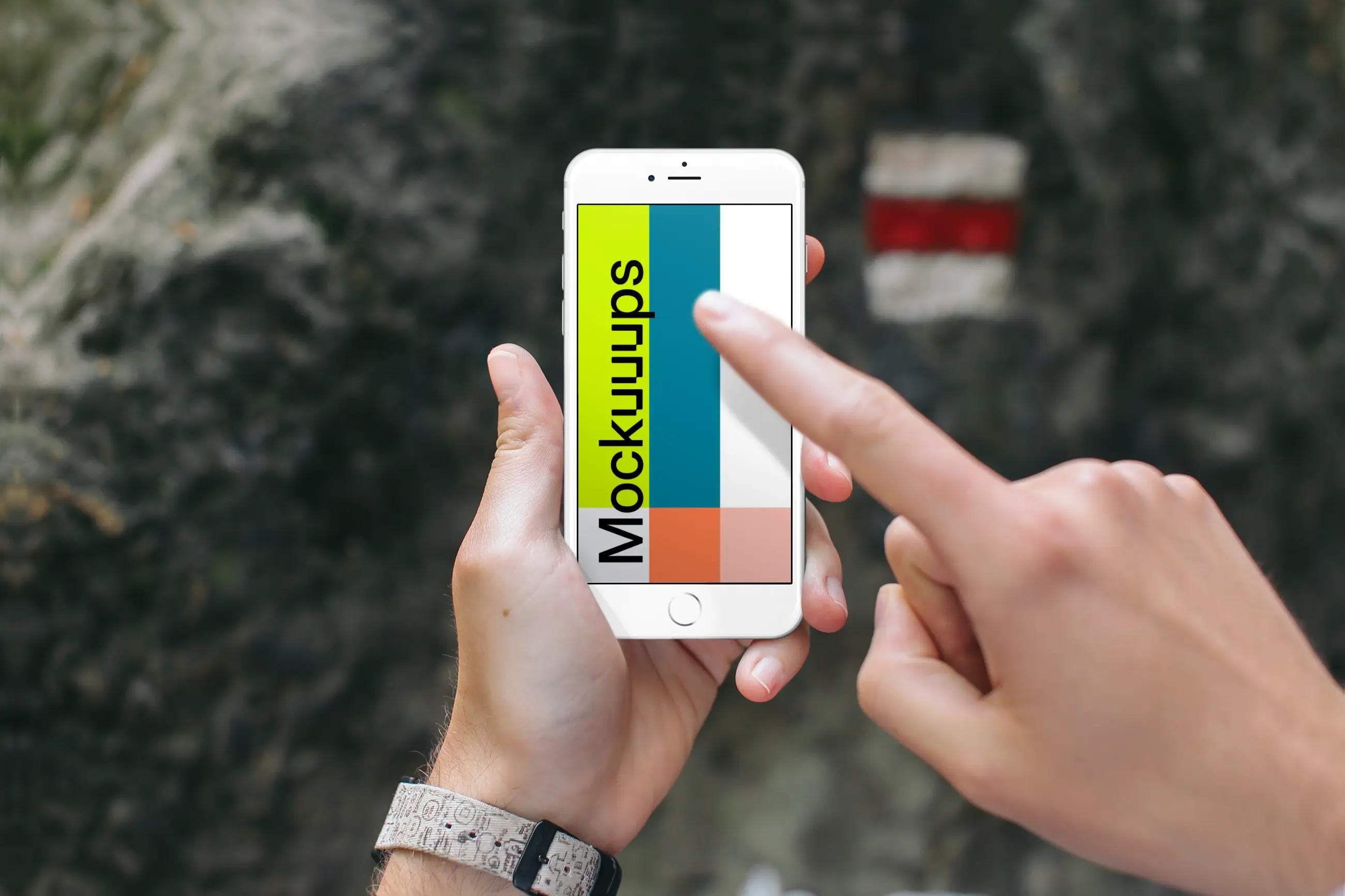 Pointing on iPhone 6s mockup in front of a Tourist Sign