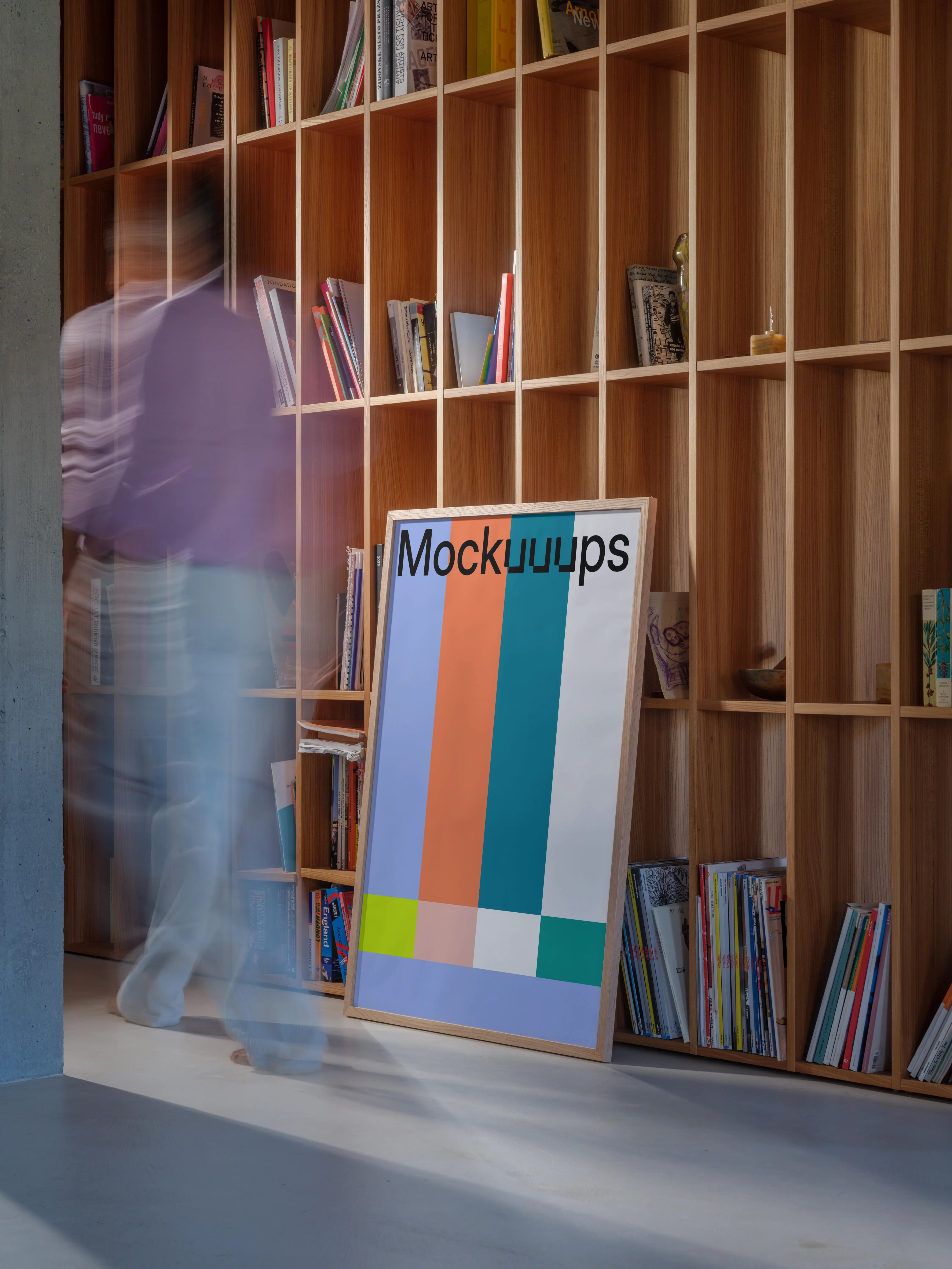 Poster mockup leaning against a wooden bookshelf