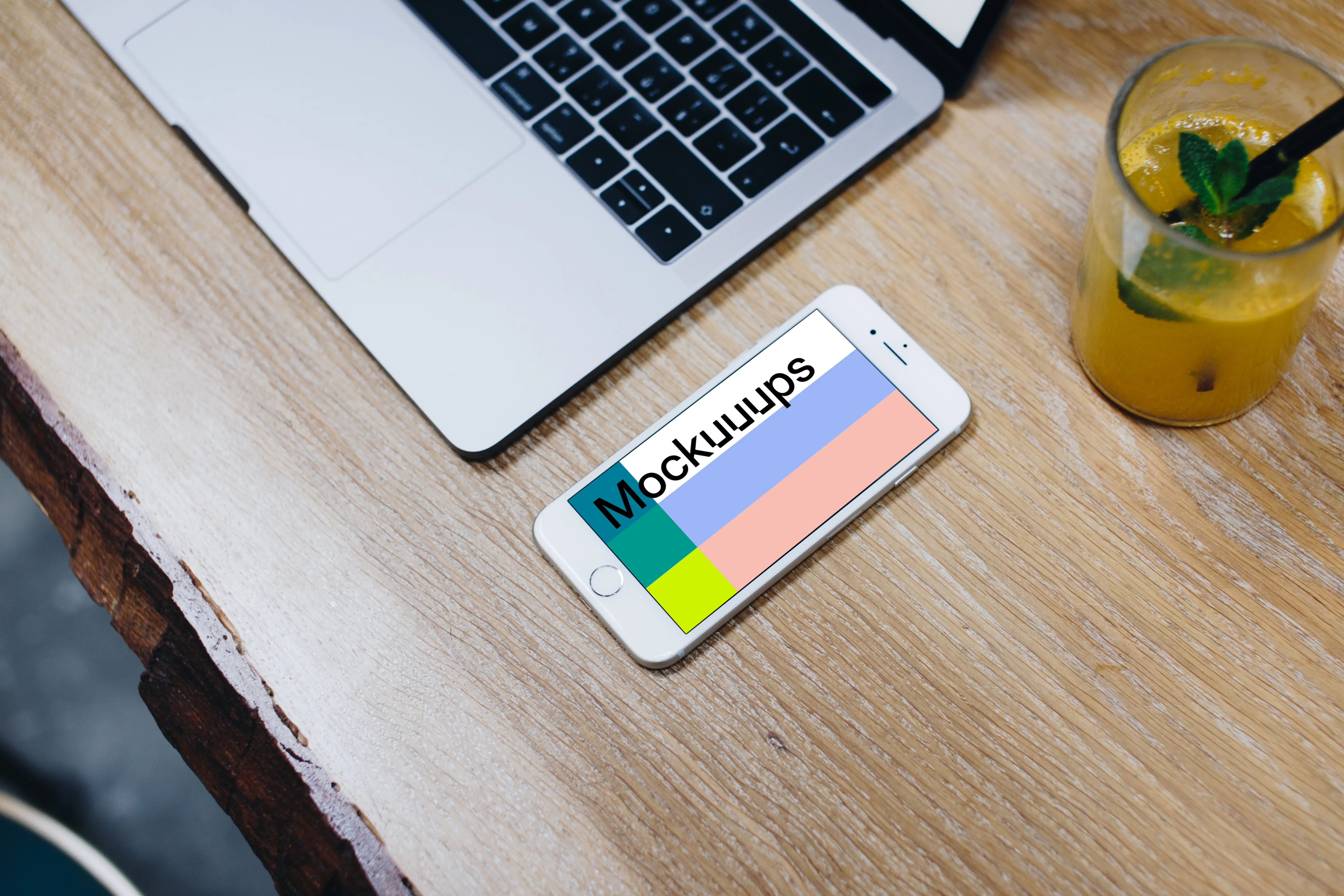 Silver iPhone 7 mockup on the wooden table