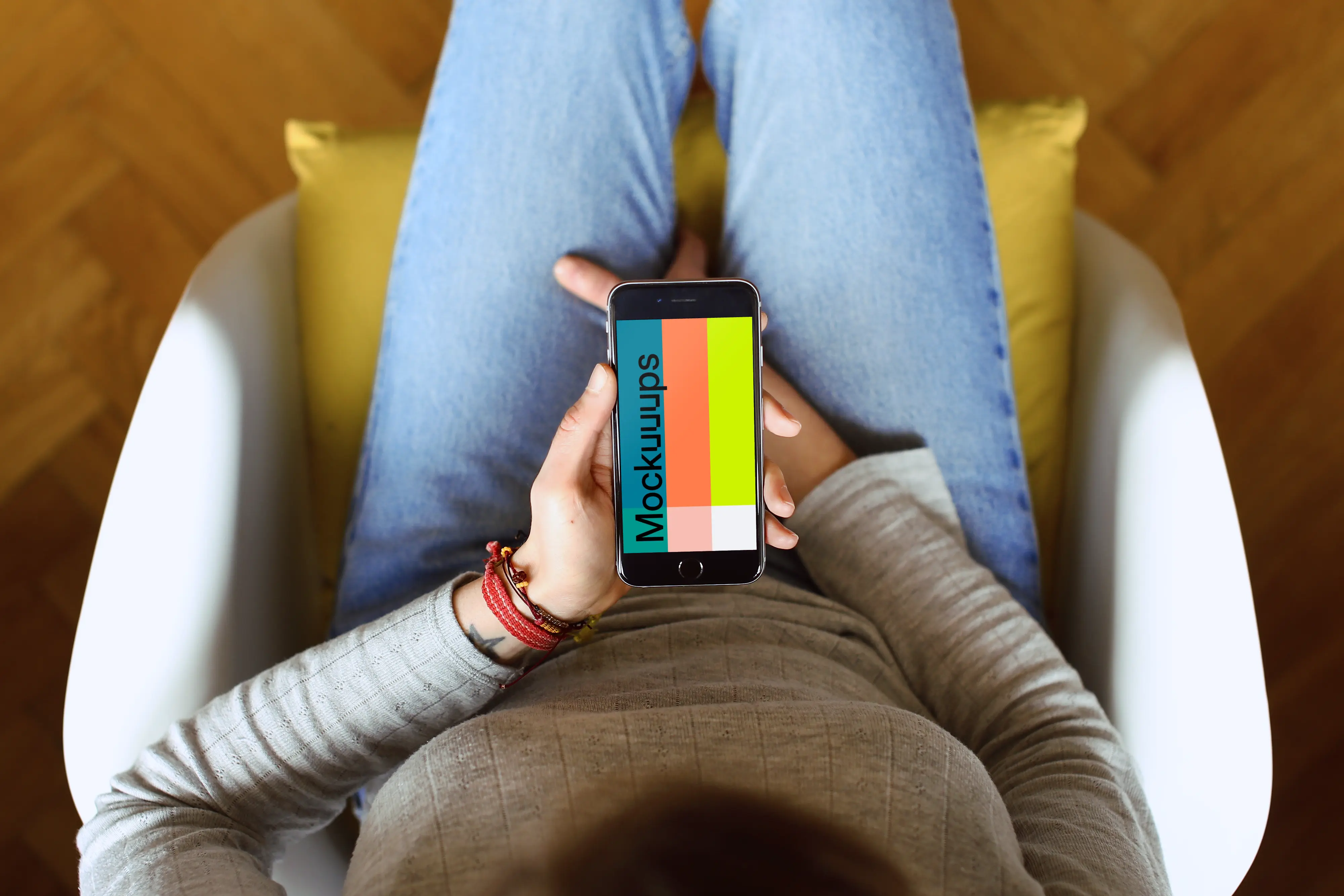 Sitting on the chair with iPhone 6s mockup