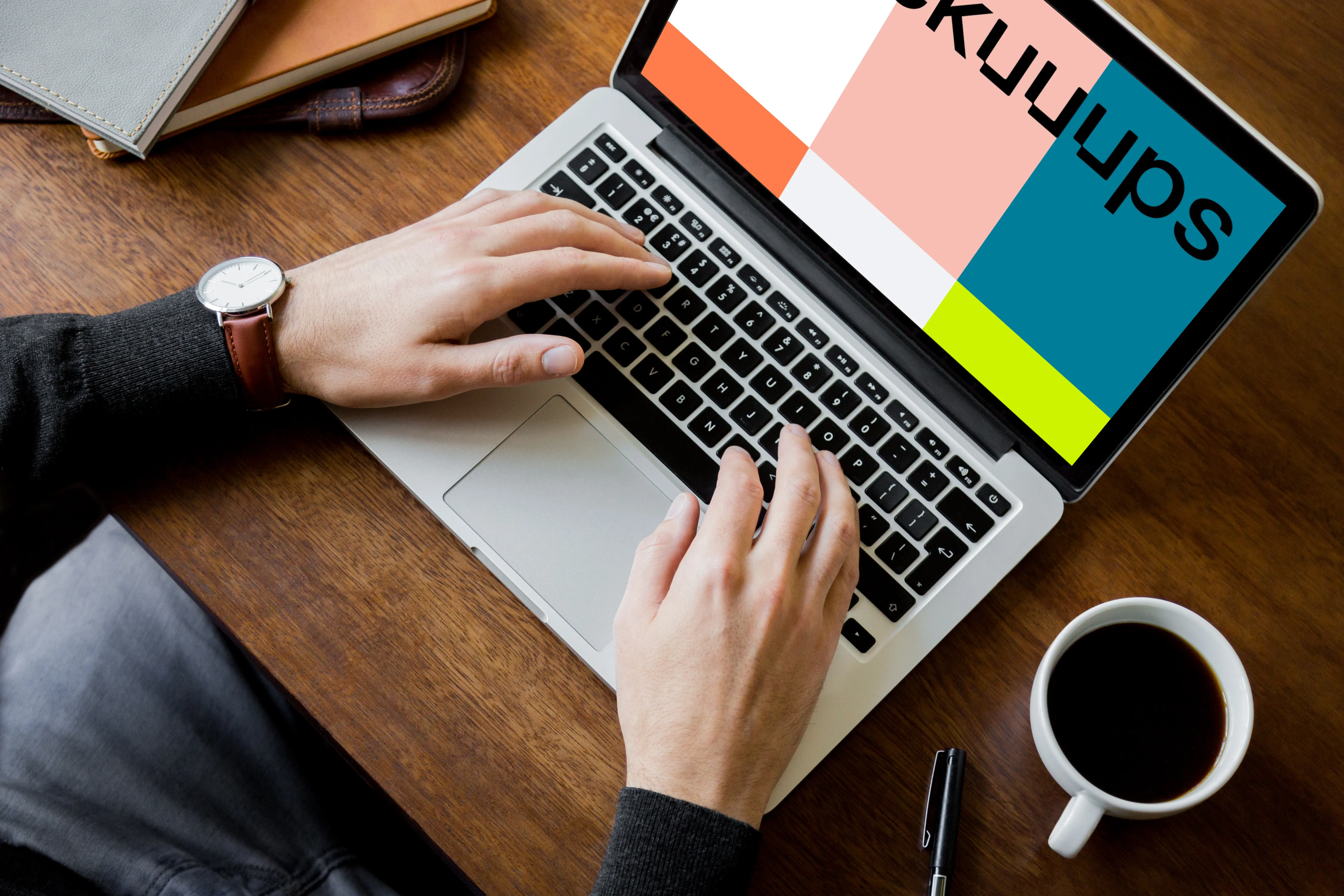 Sitting with coffee and working on Macbook Pro mockup