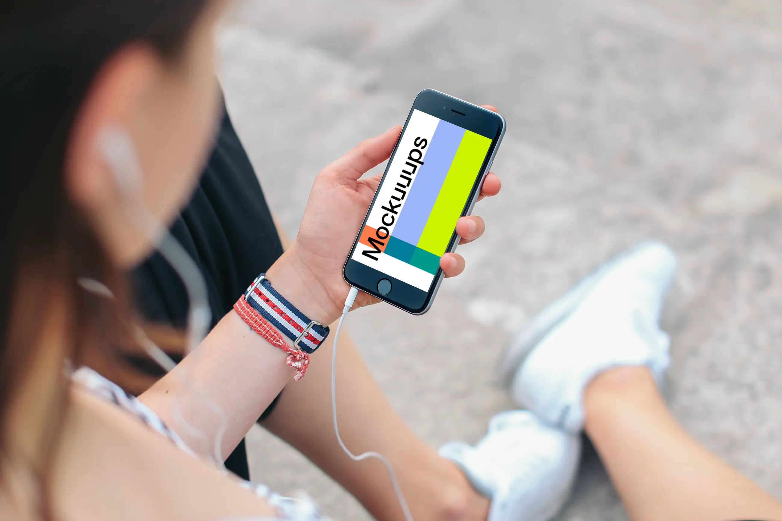 Sitting with iPhone 6 mockup and Headphones