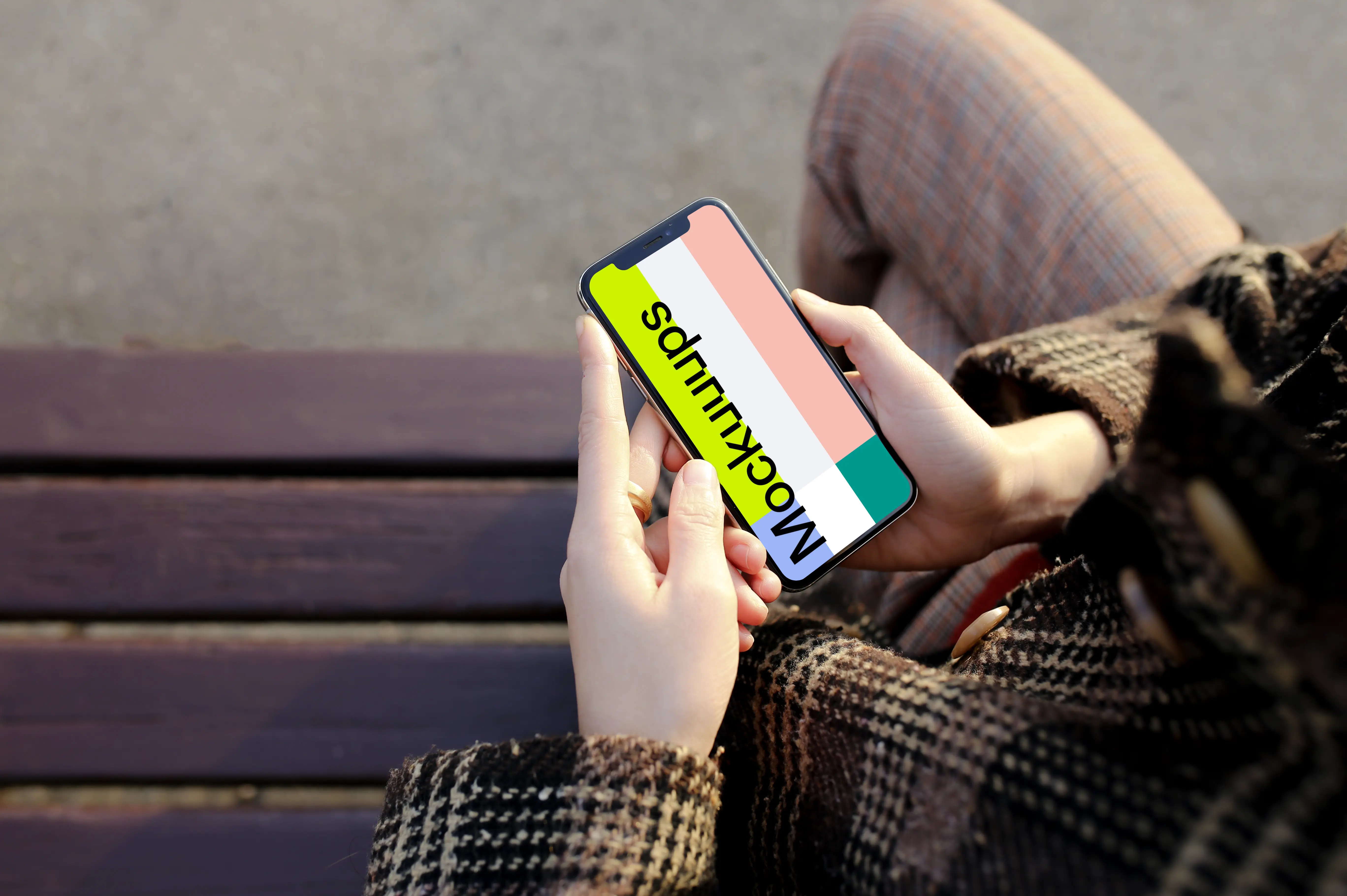 Sitting with iPhone X mockup