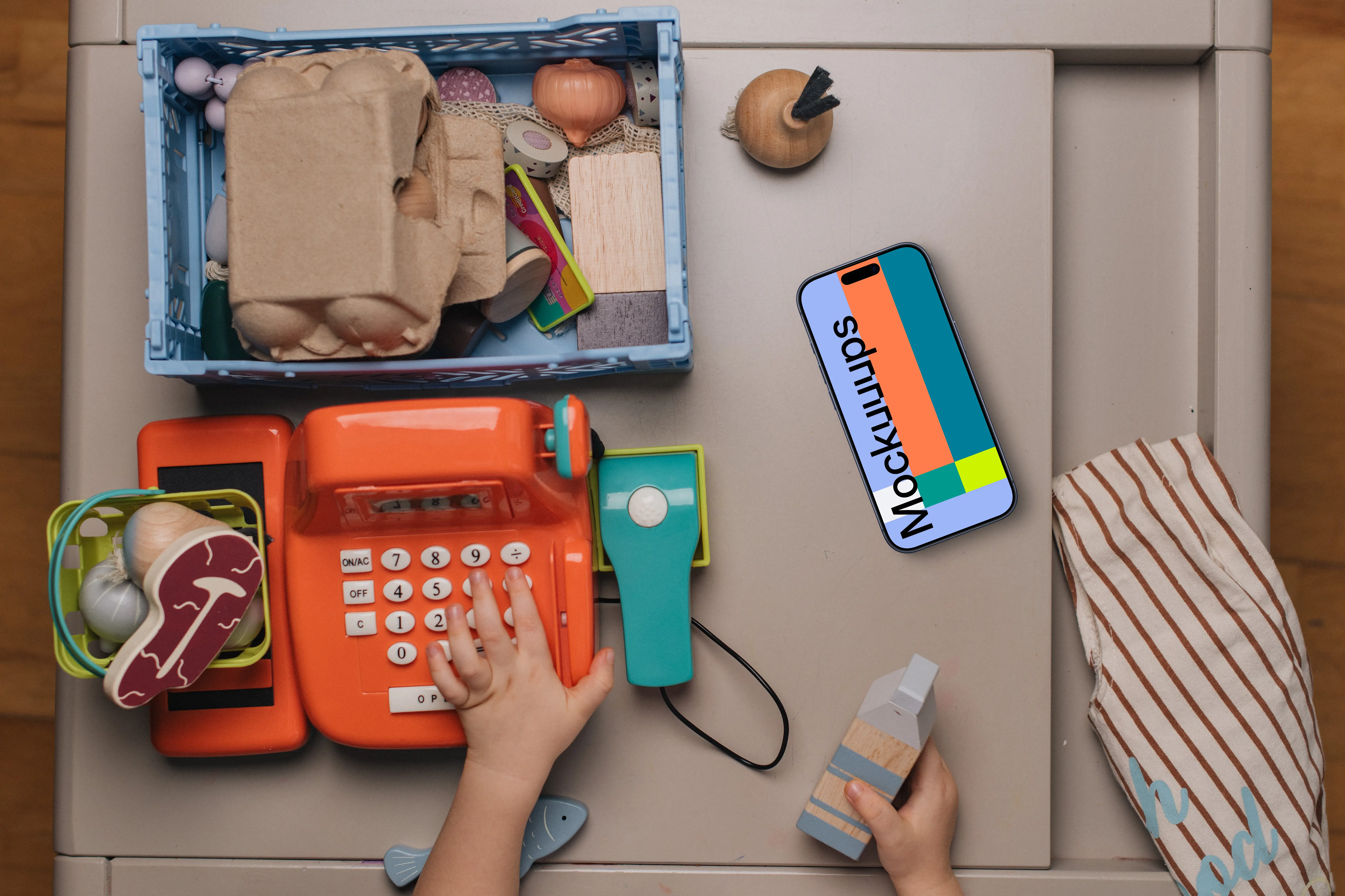 Smartphone mockup amidst children's toys
