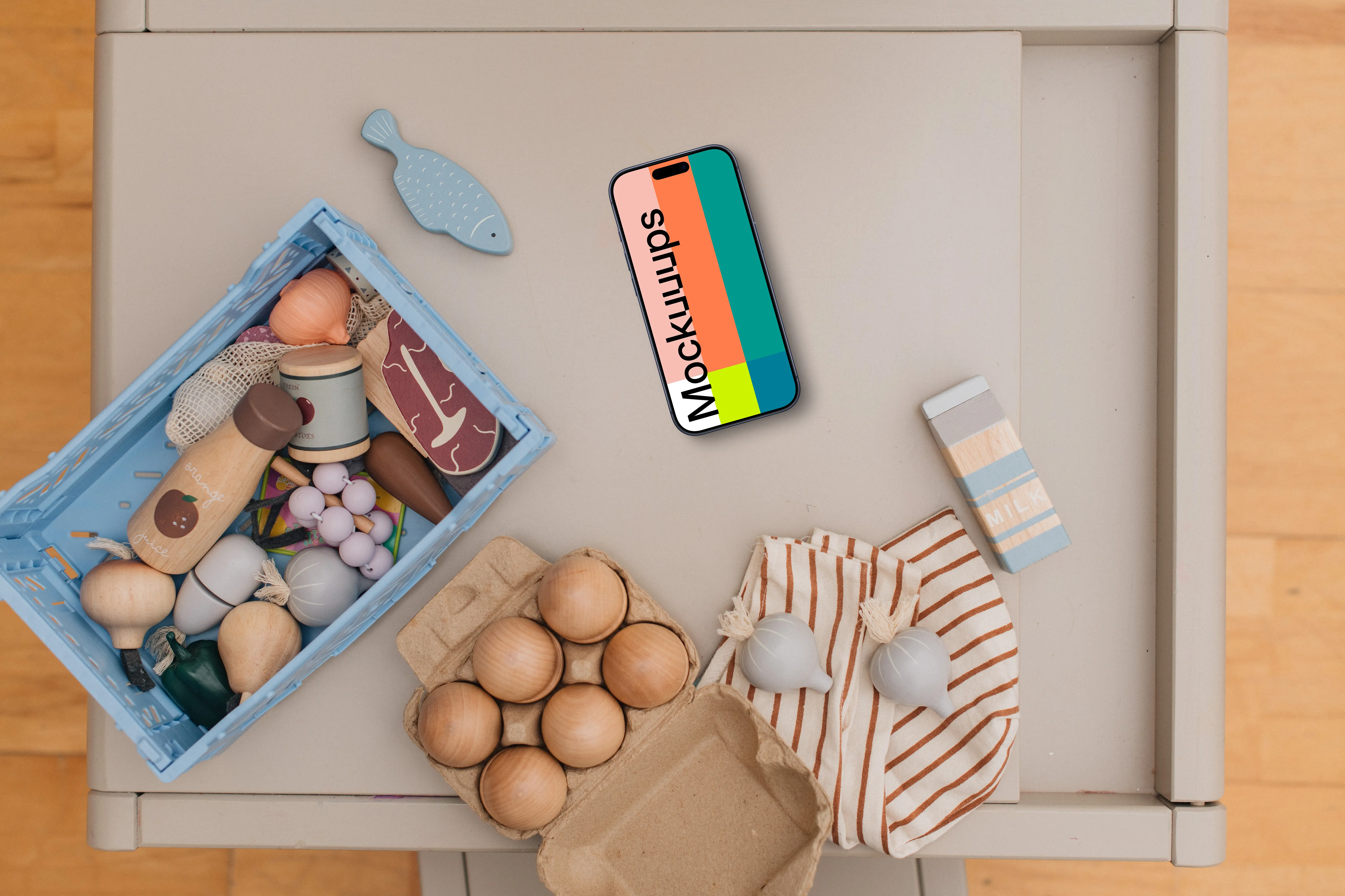 Smartphone mockup among children's toys