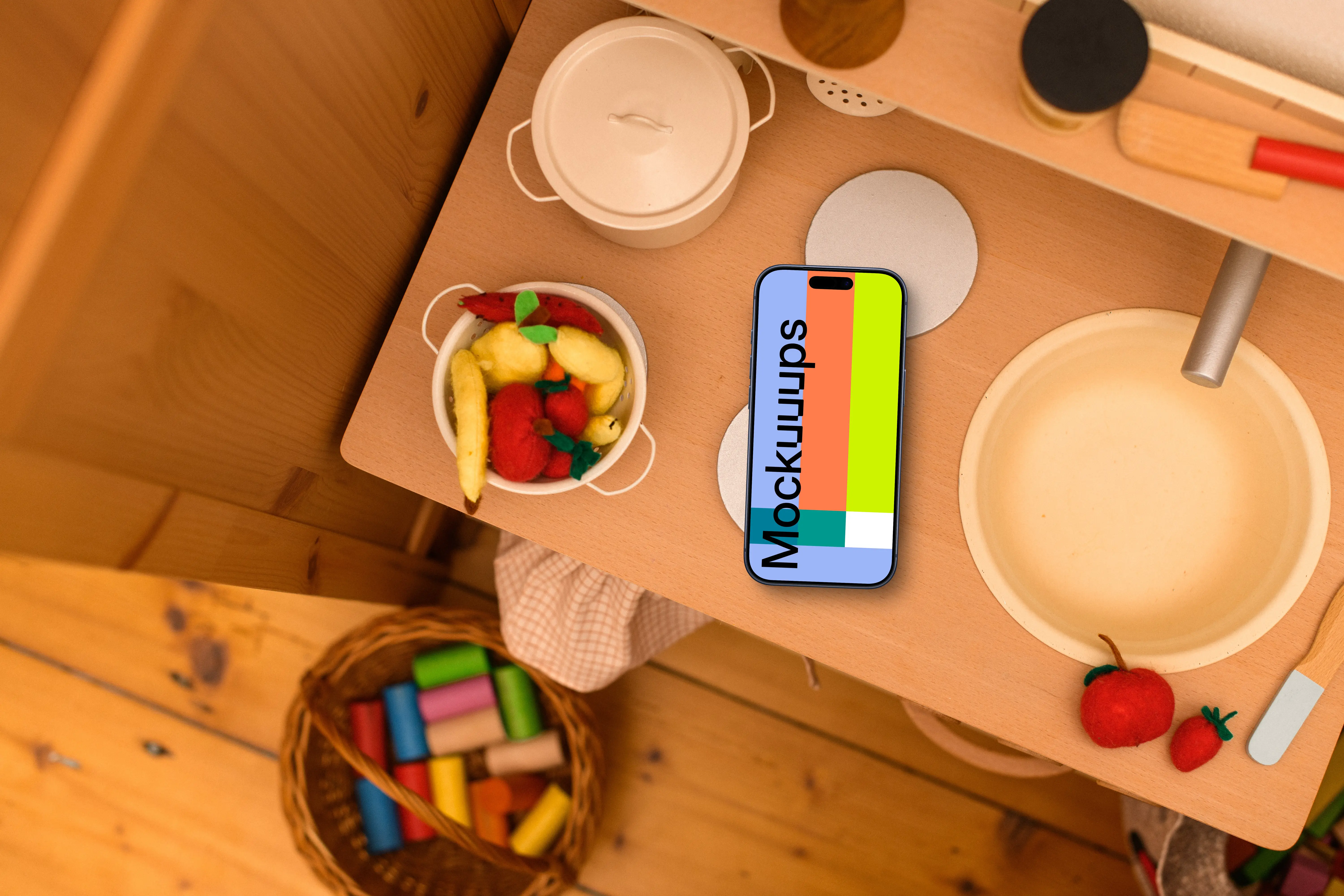Smartphone mockup on a kid's creative table