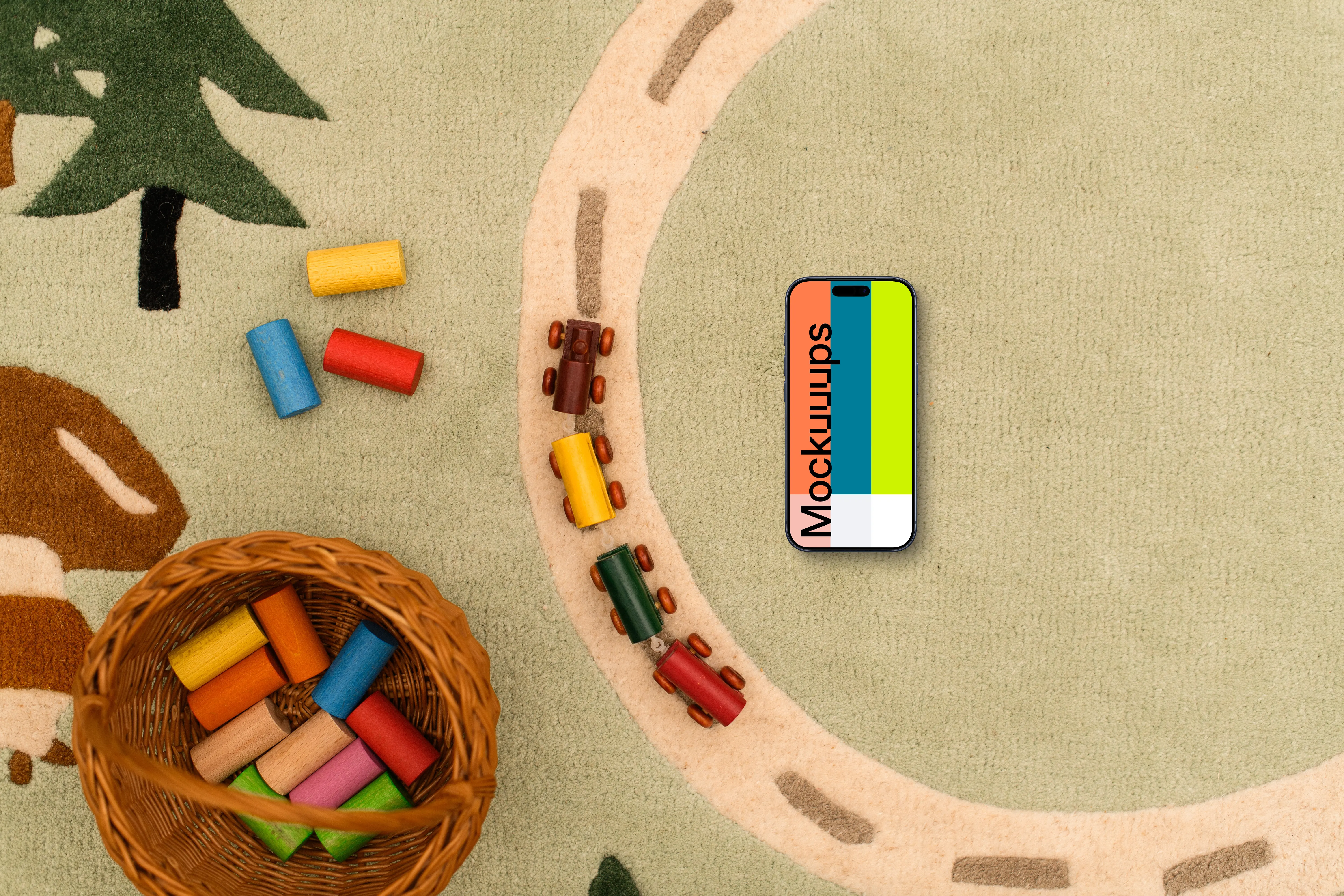 Smartphone mockup with colorful toy blocks on a child-themed rug