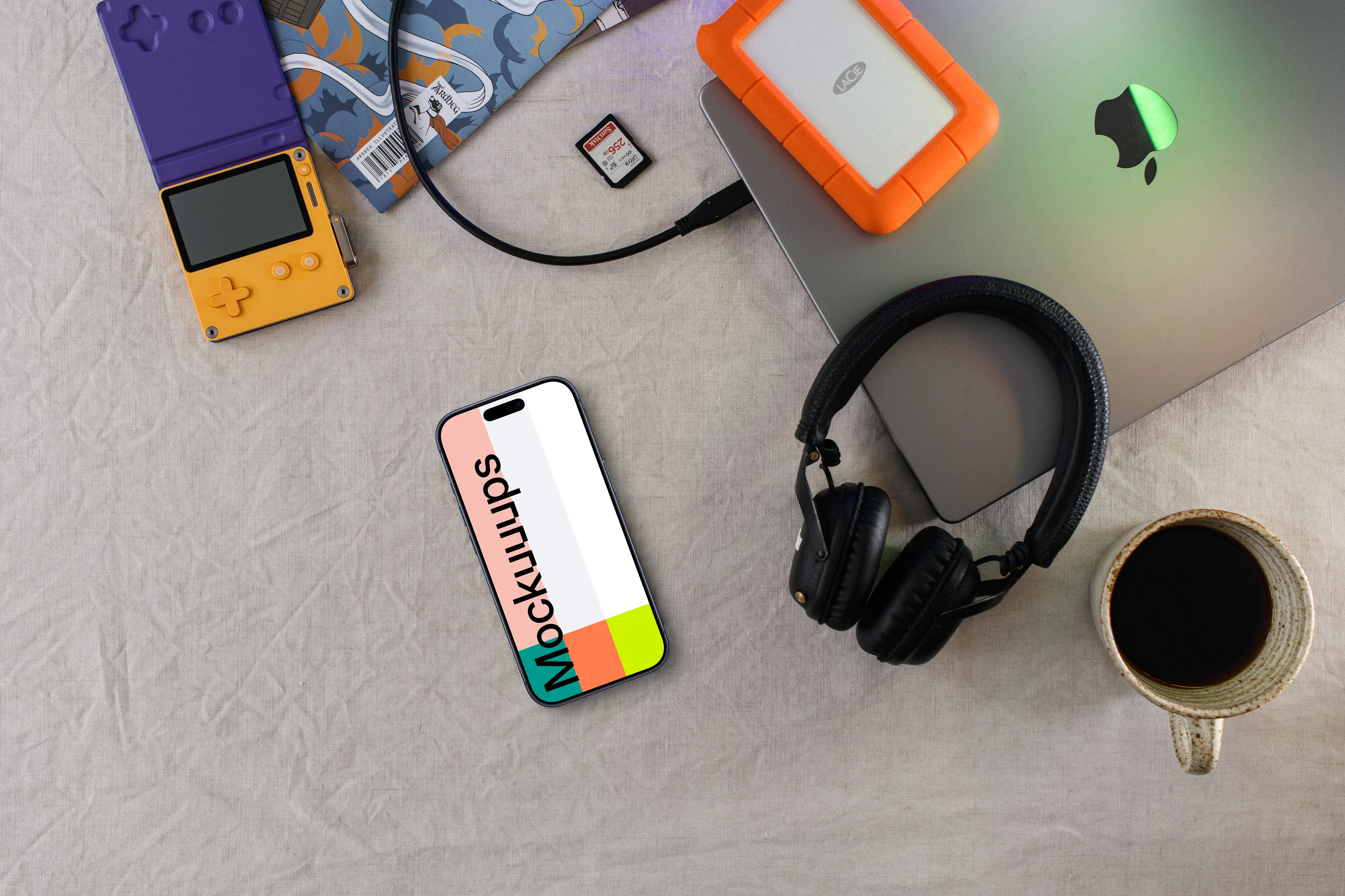 Smartphone mockup with tech gadgets and coffee