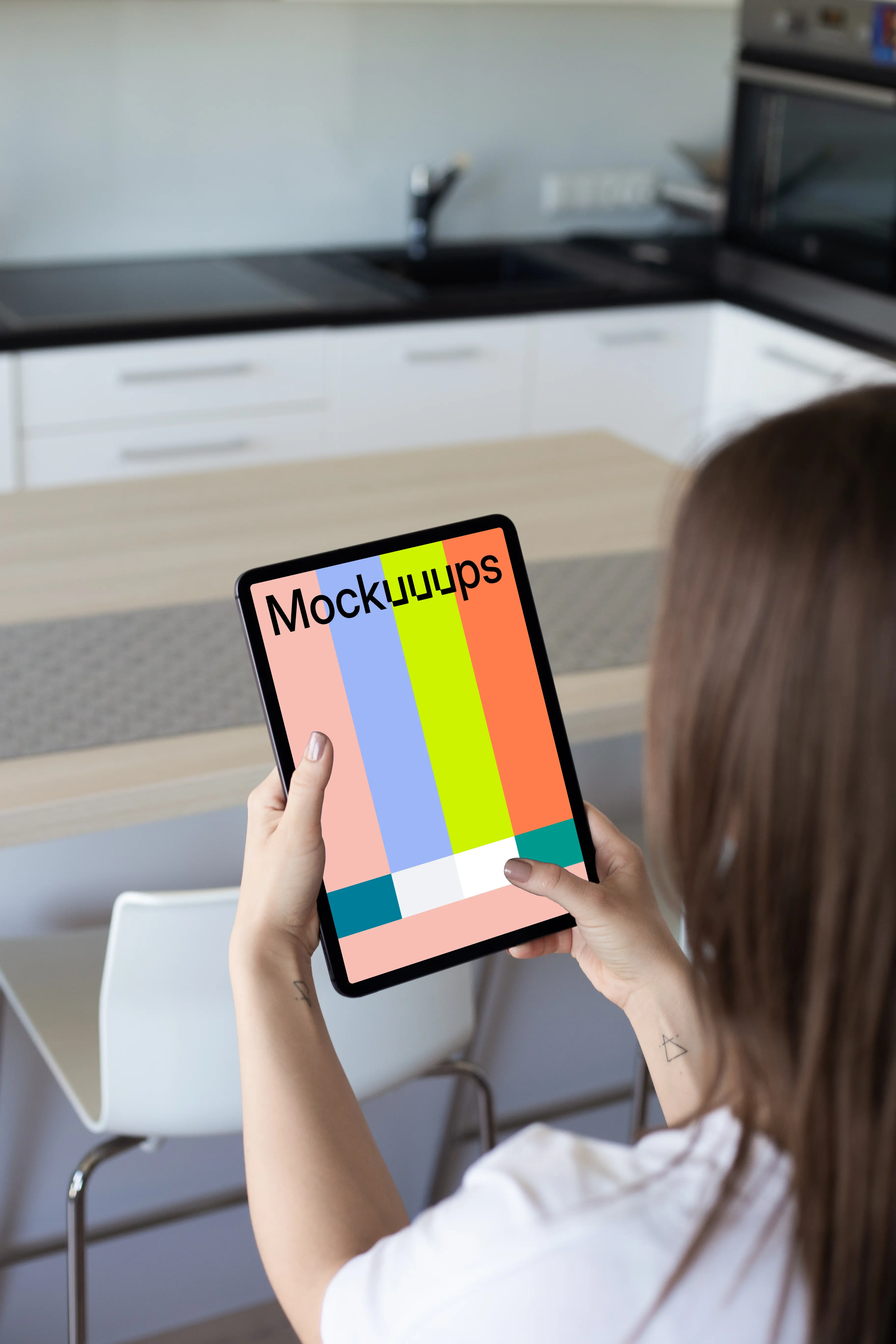 Tablet mockup held by lady in a kitchen