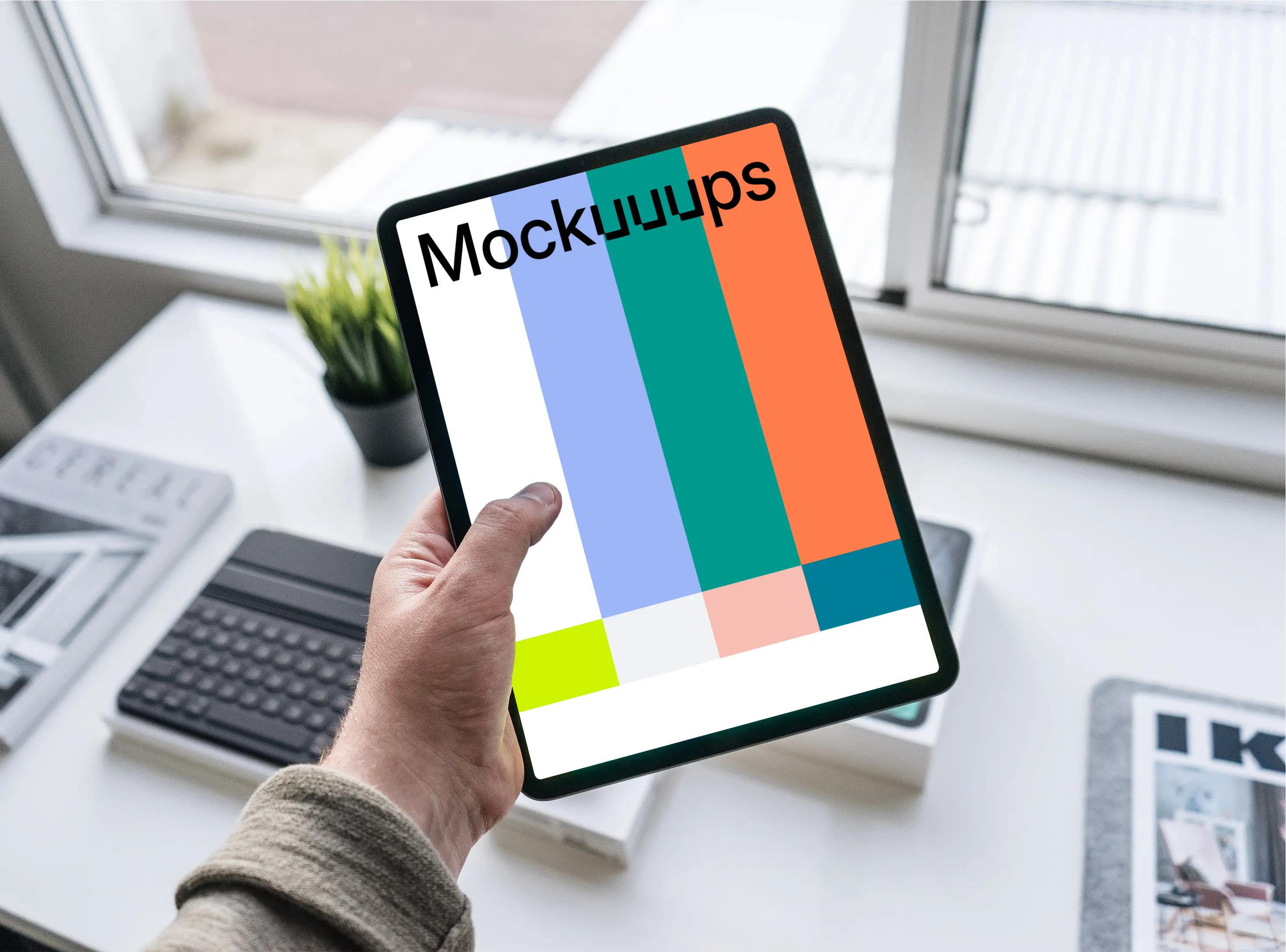 Tablet mockup held by man over work desk 