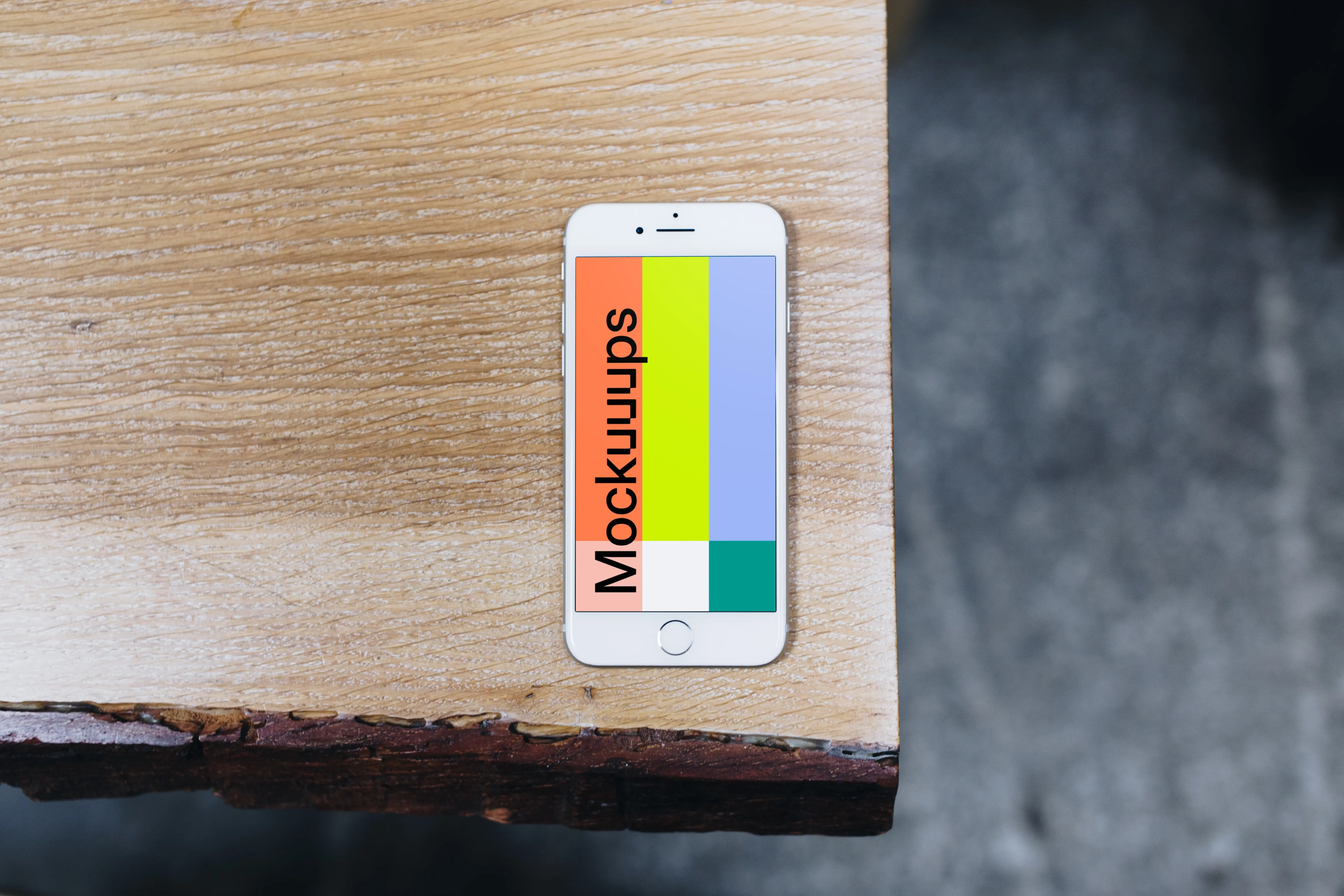 Top view mockup of iPhone 7 Silver mockup on the wooden table