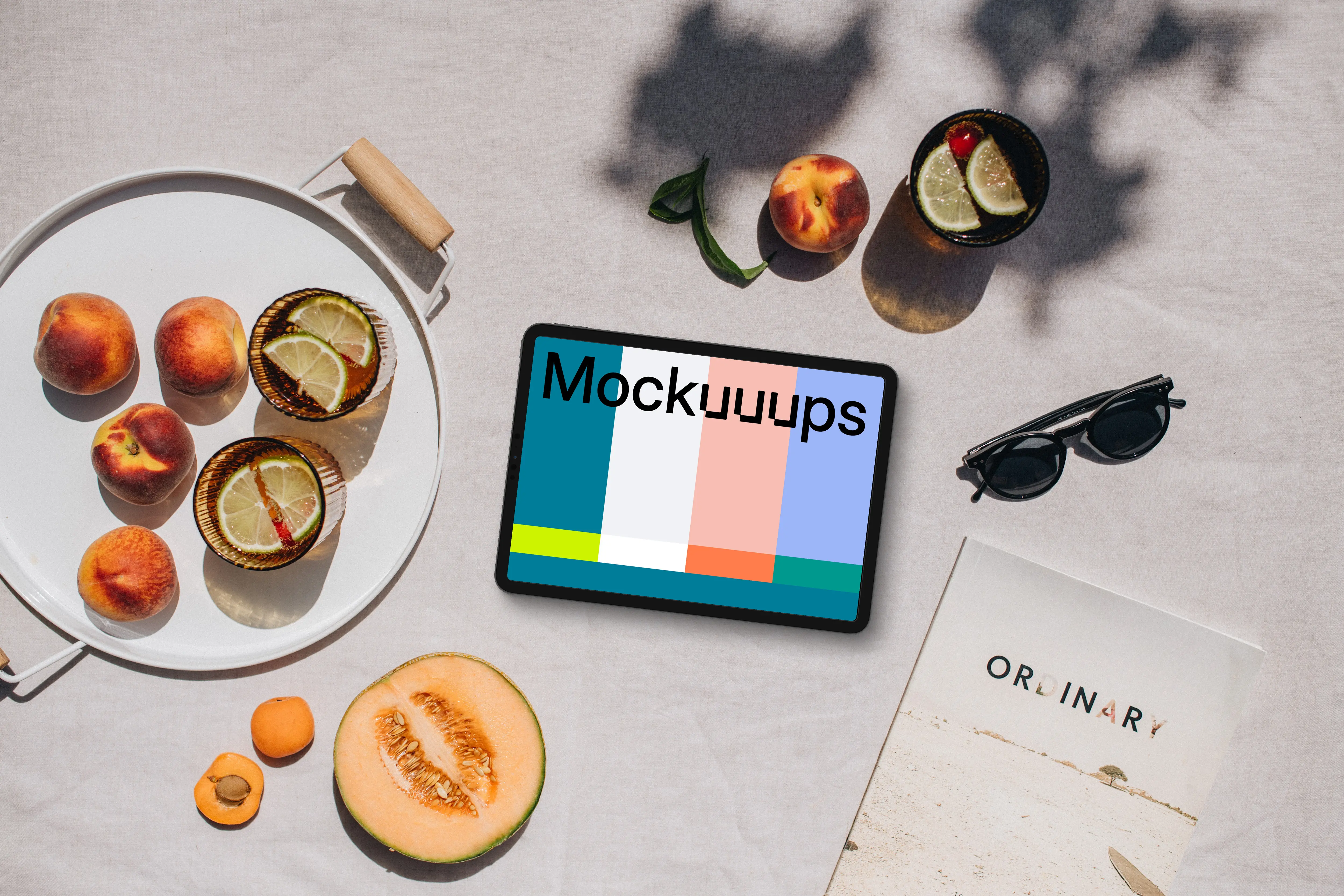 Top view of landscape tablet mockup with a magazine on the side