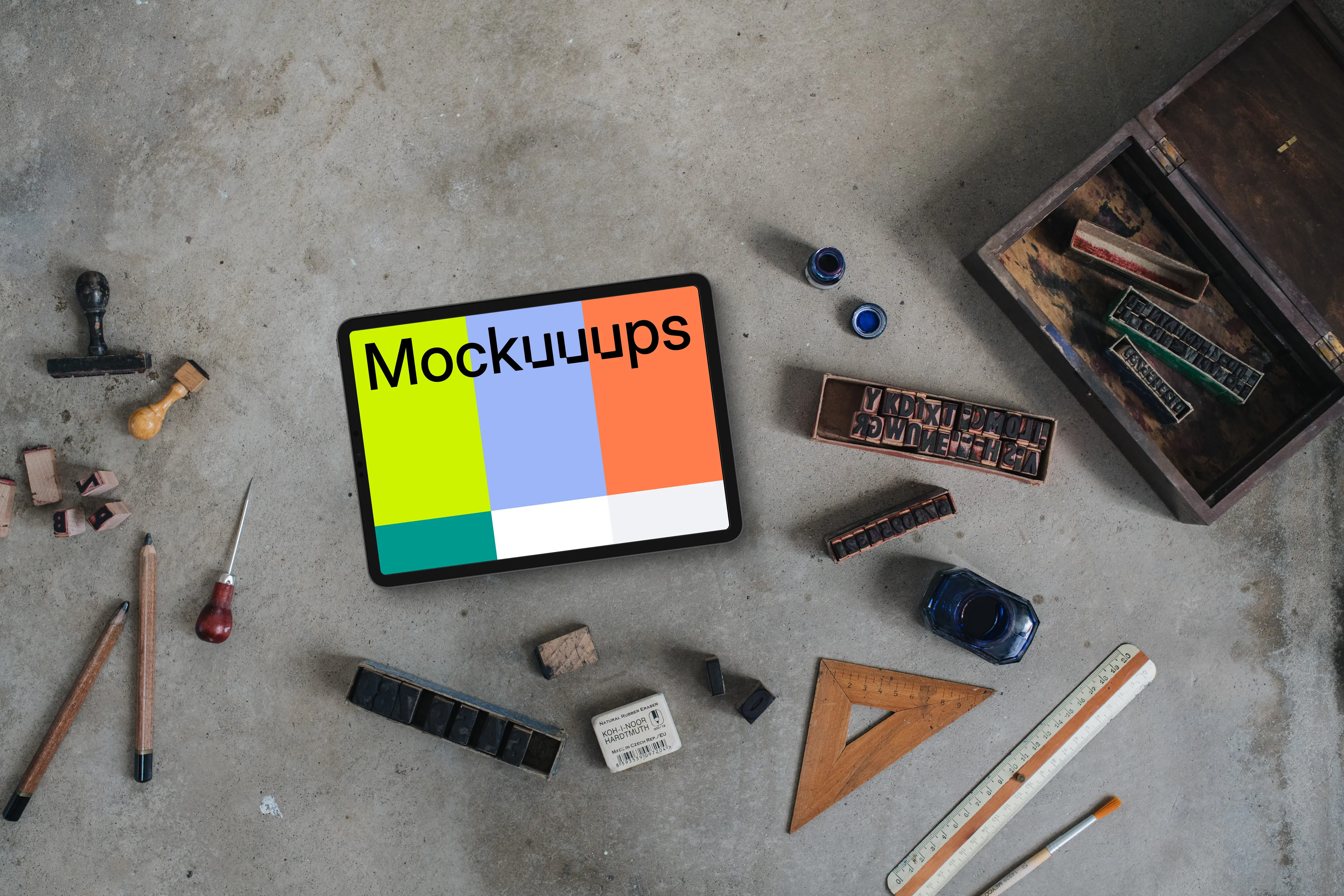 Top view of landscape tablet mockup with stamps and rulers