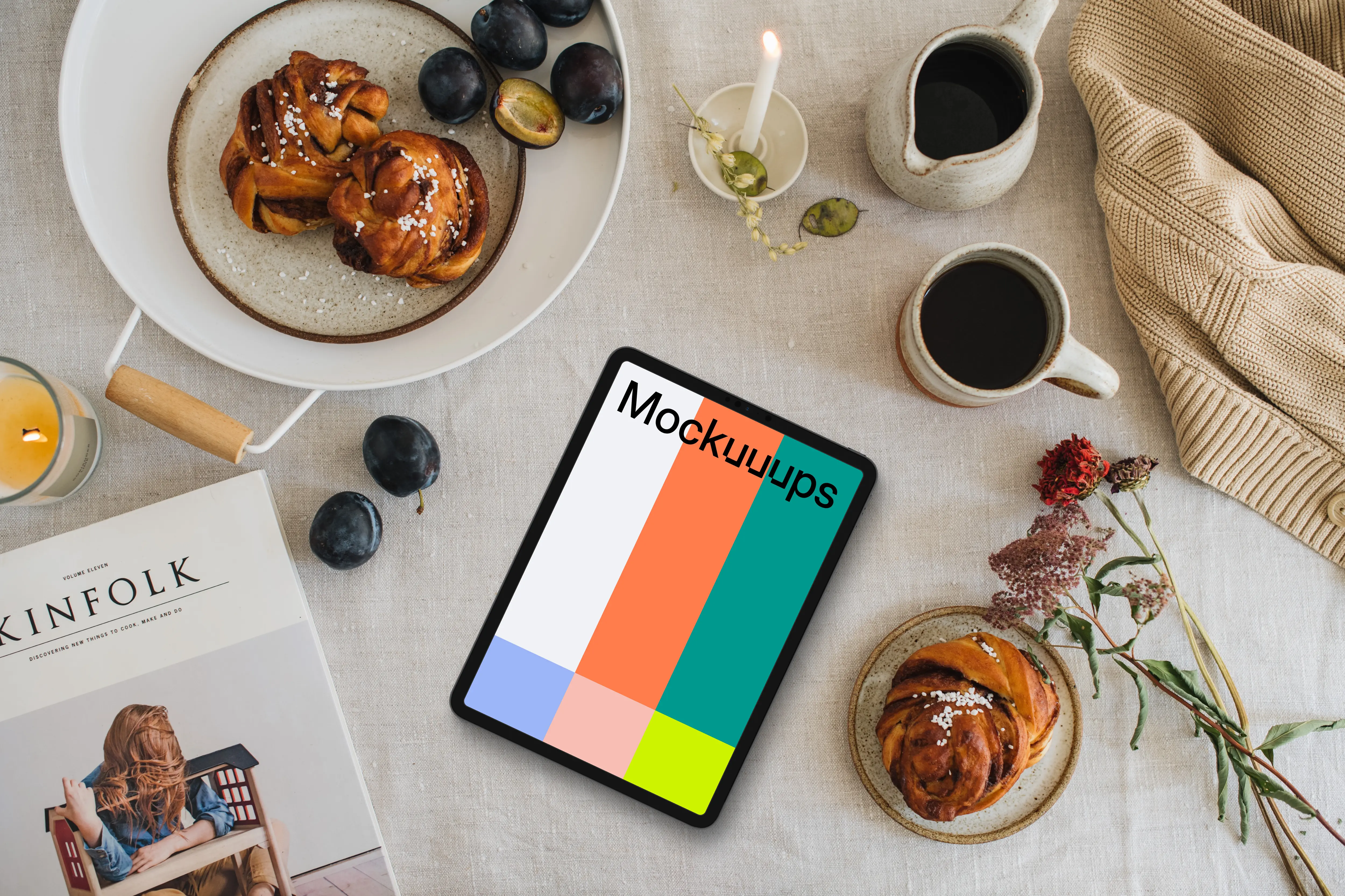 Top view of tablet mockup next to the magazine