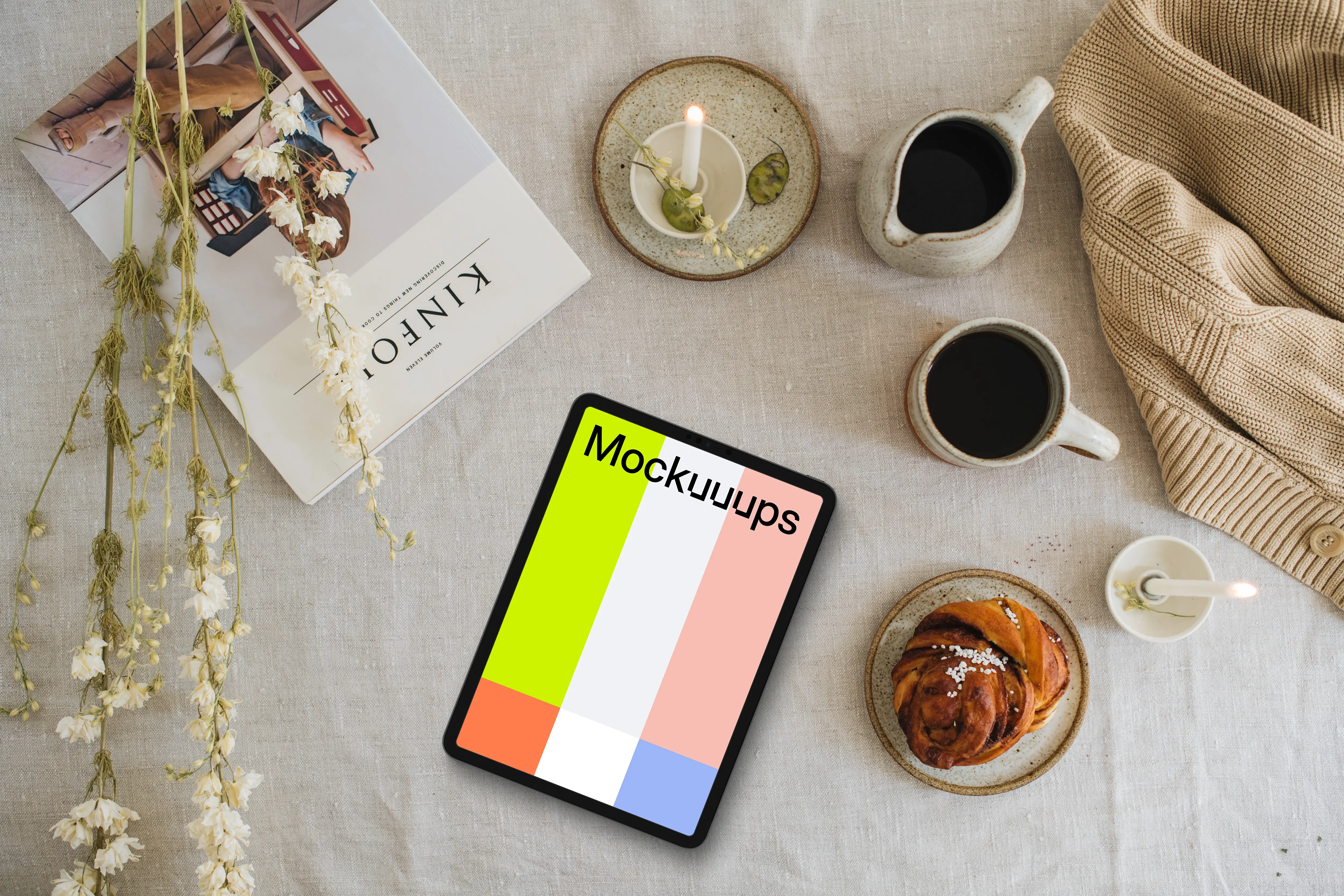 Top view of tablet mockup with a magazine on the side