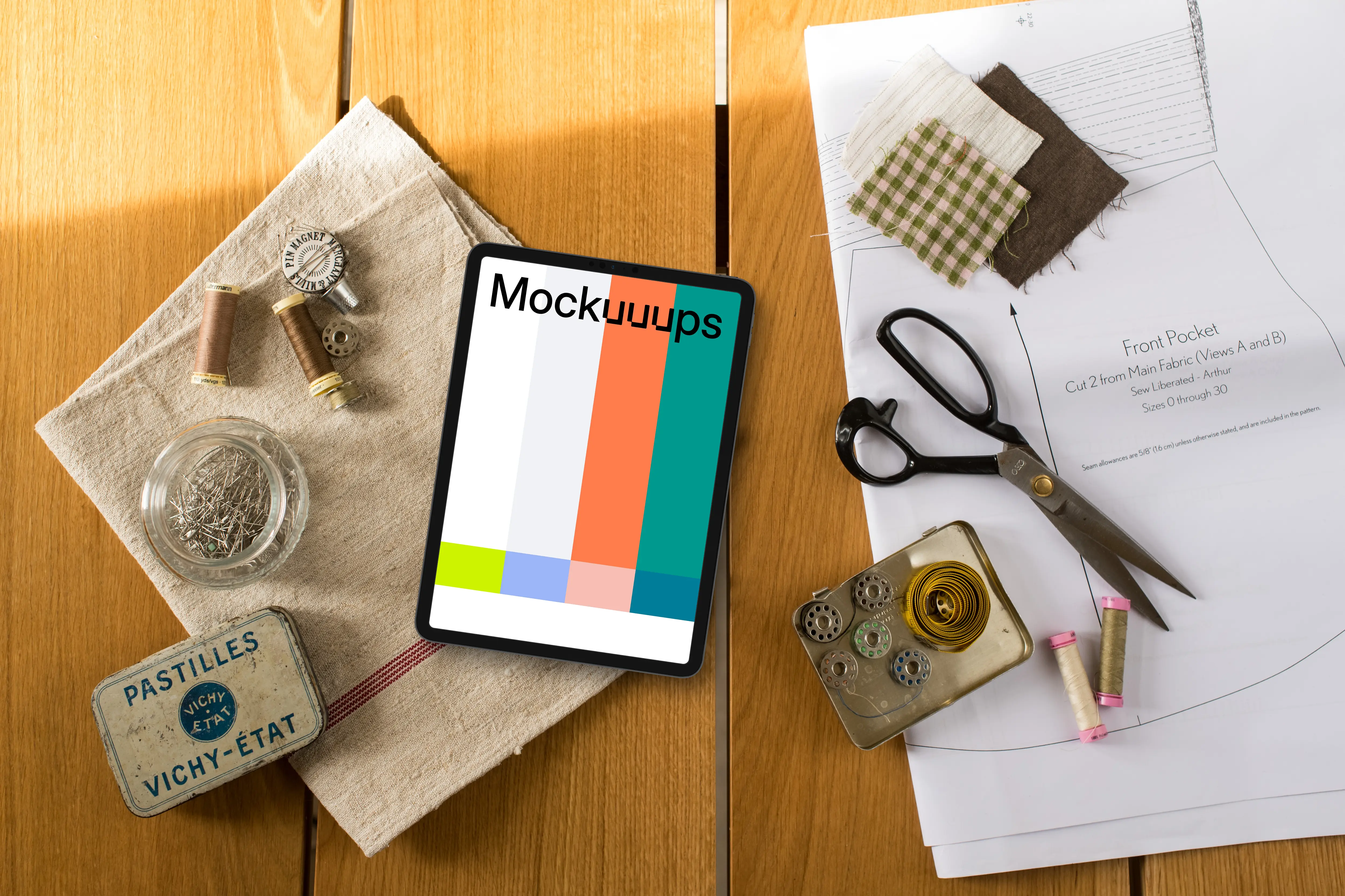 Top view of tablet mockup with sewing table on the side