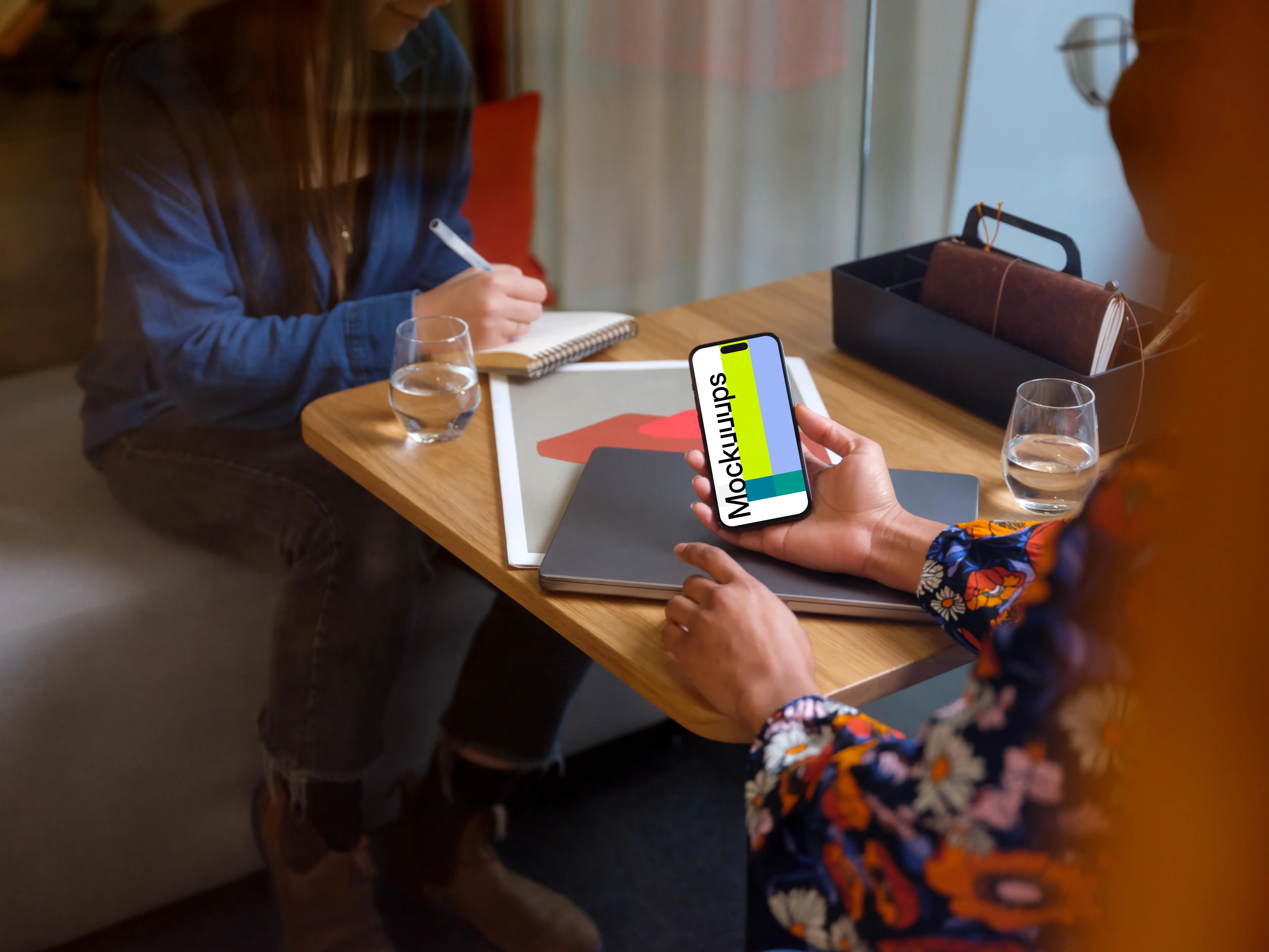 Woman holding an iPhone 14 Pro mockup